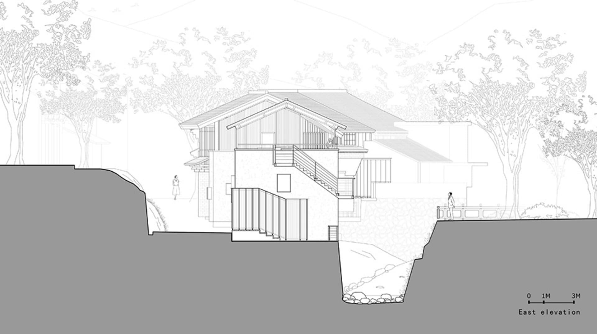 A modern two-story house with a large deck and stairs leading to a lower level, featuring a mix of concrete, wood, and glass materials, with natural light coming through windows