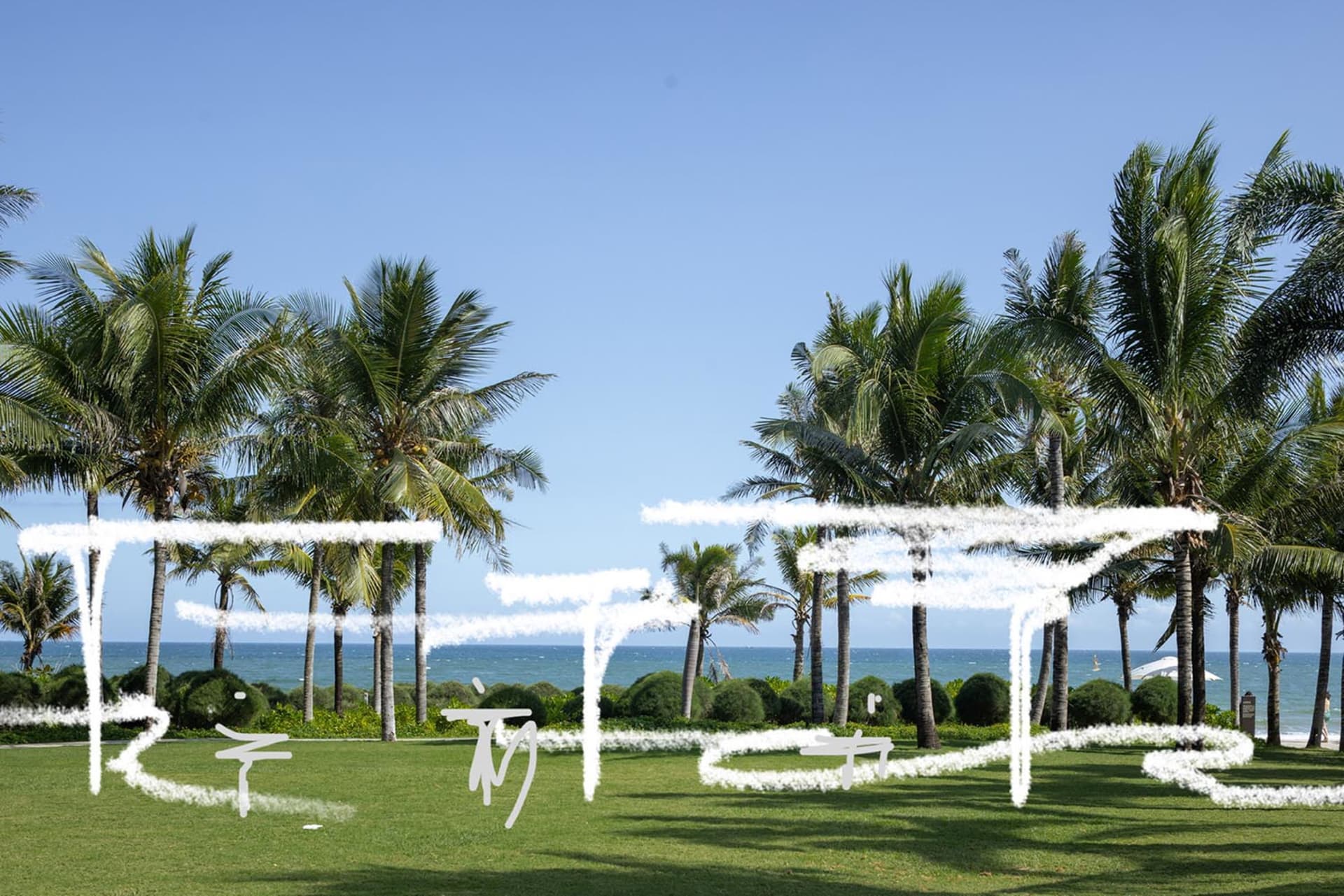 A relaxed beach house patio with multiple chairs and dining tables, surrounded by ocean views and perfect for outdoor dining