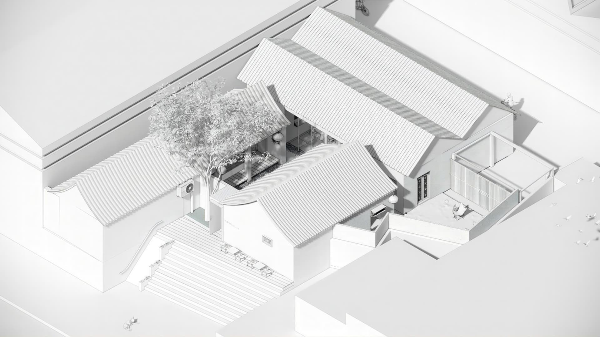 A modern house with a white roof and gray walls, featuring a patio with comfortable outdoor seating and a clean design