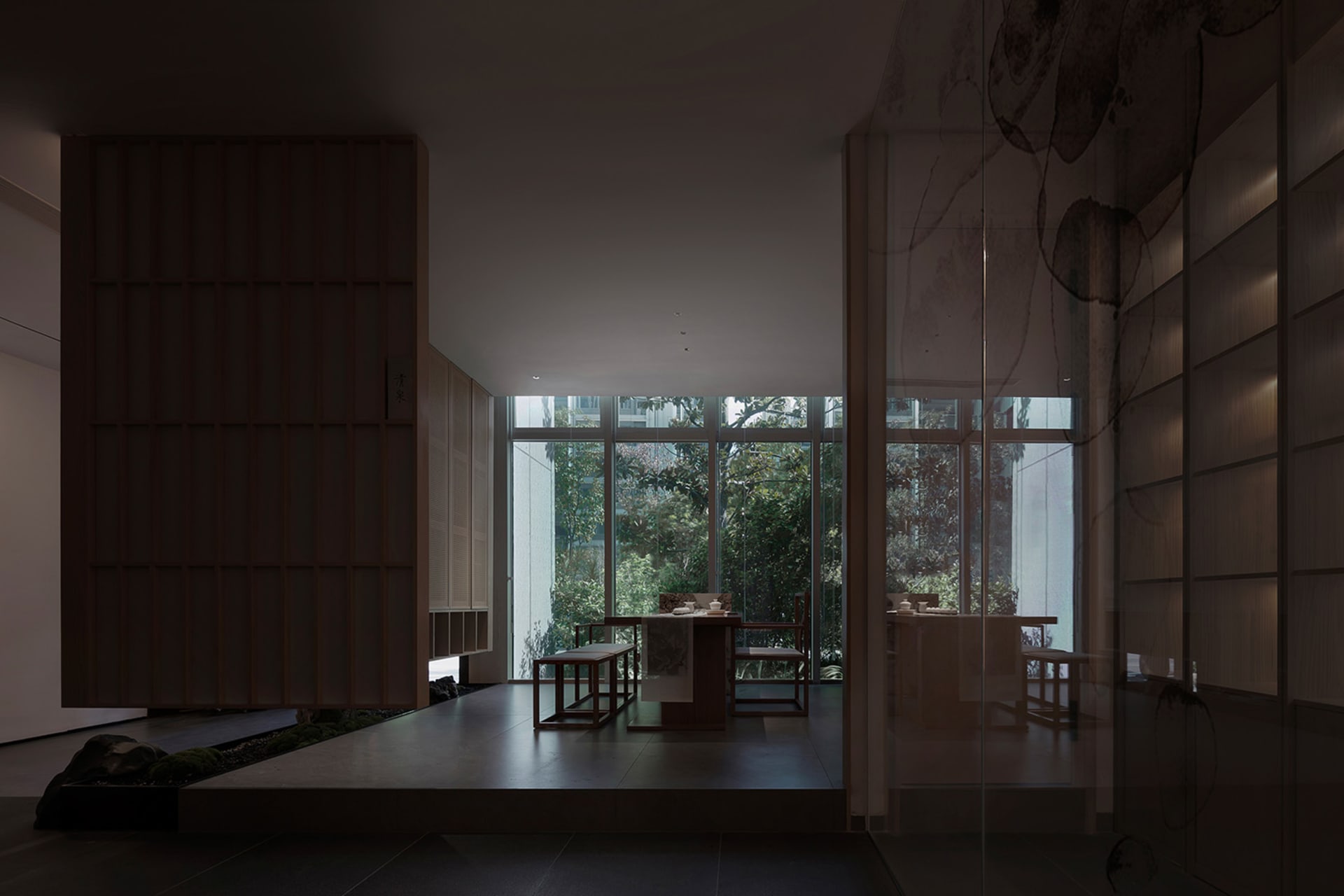A cozy dining area with two tables, chairs, and a window allowing natural light to enter the space
