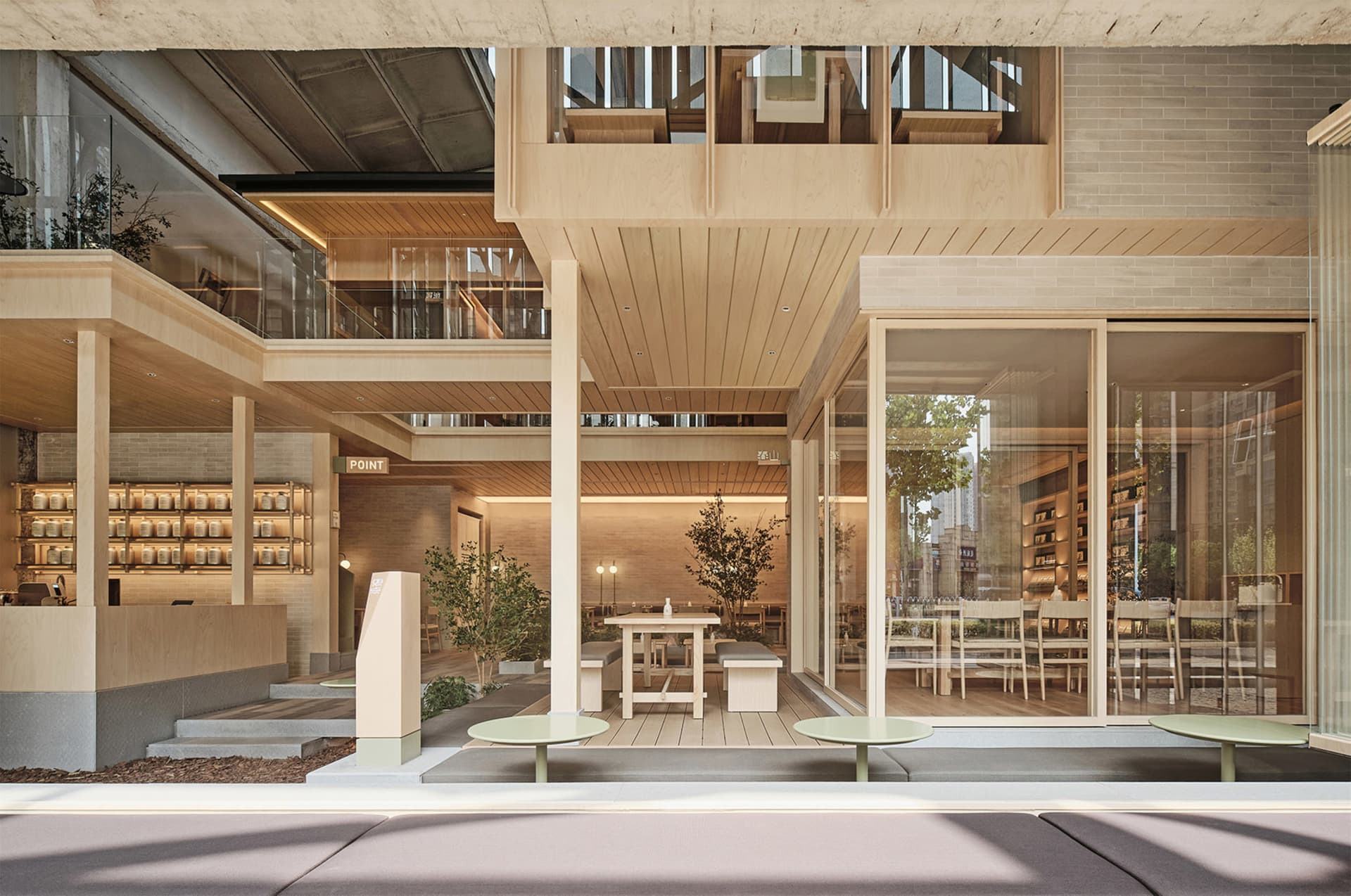 Open dining area with modern design, multiple tables, chairs, and potted plants, inviting atmosphere