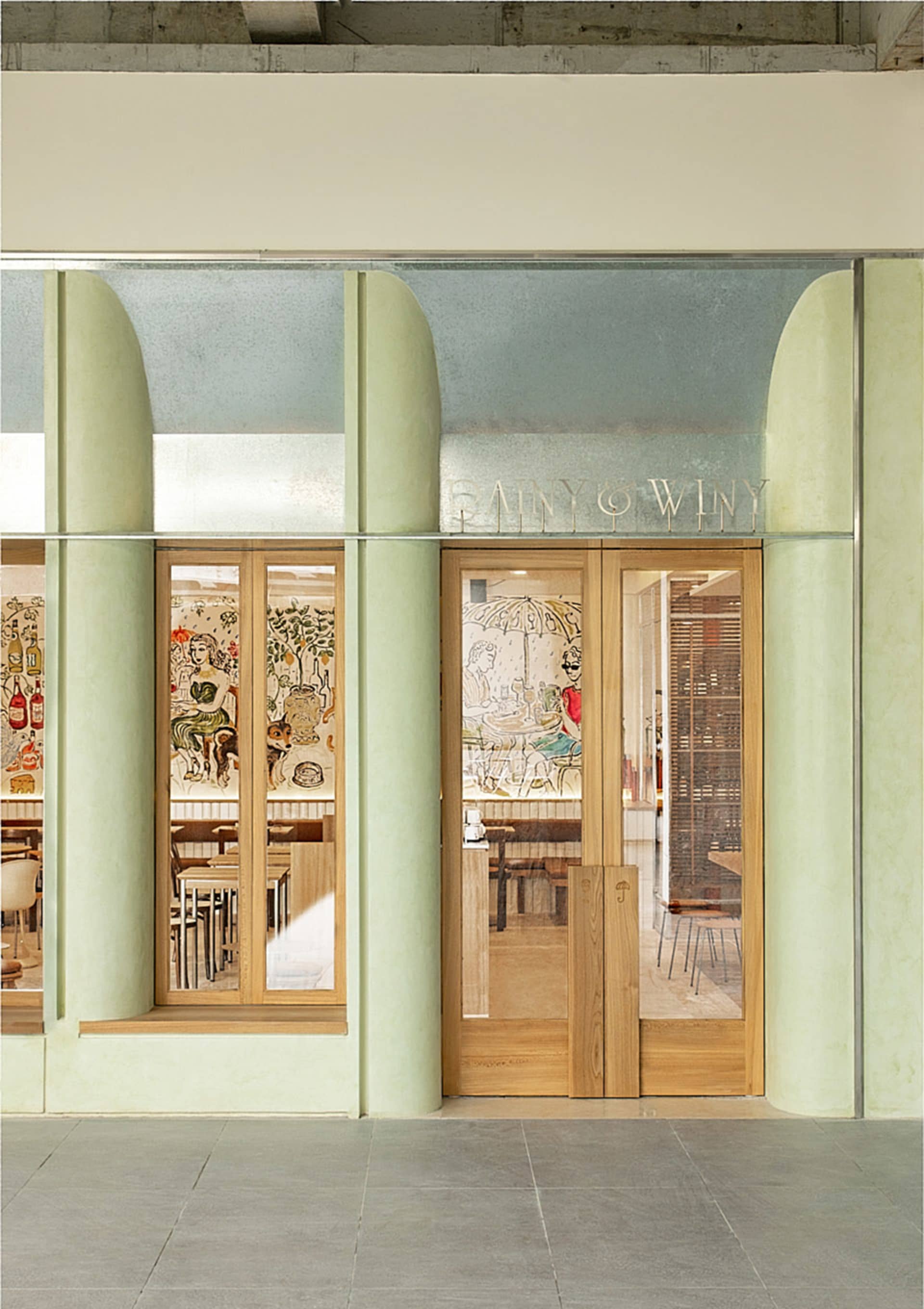 A restaurant interior with dining tables and chairs, creating a warm and inviting atmosphere for customers