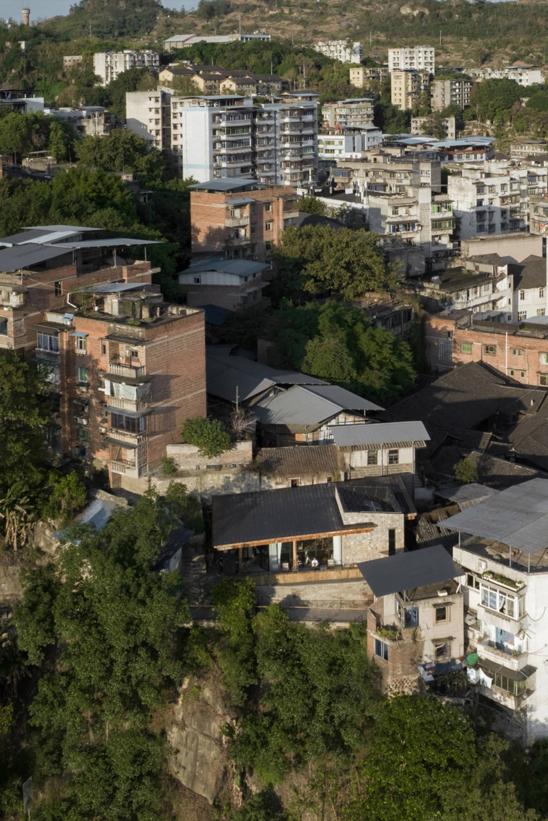 A cityscape with a mix of residential and commercial buildings, featuring a blend of architectural styles, neutral tones, and natural lighting