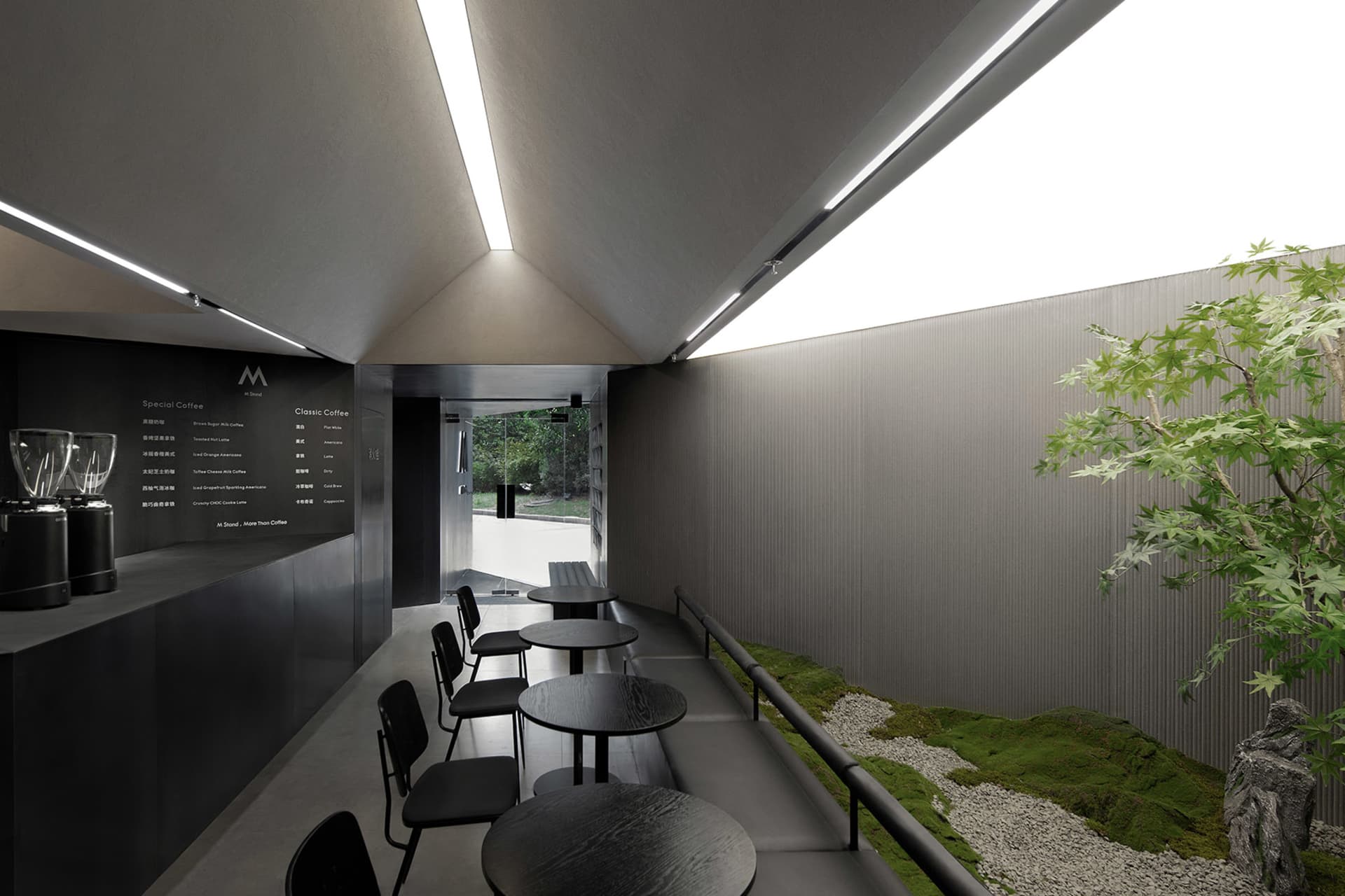 Inviting restaurant interior with multiple tables and chairs, well-lit by natural light from windows