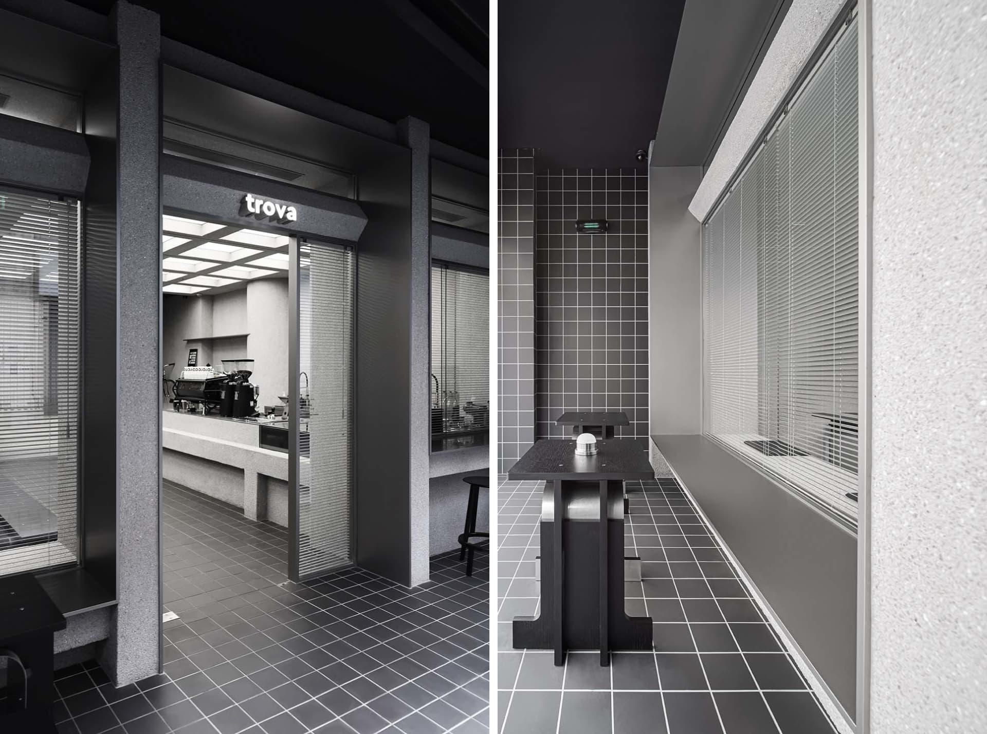 Modern bathroom interior with grey tiles, sink, toilet, and shower area in a dimly lit environment