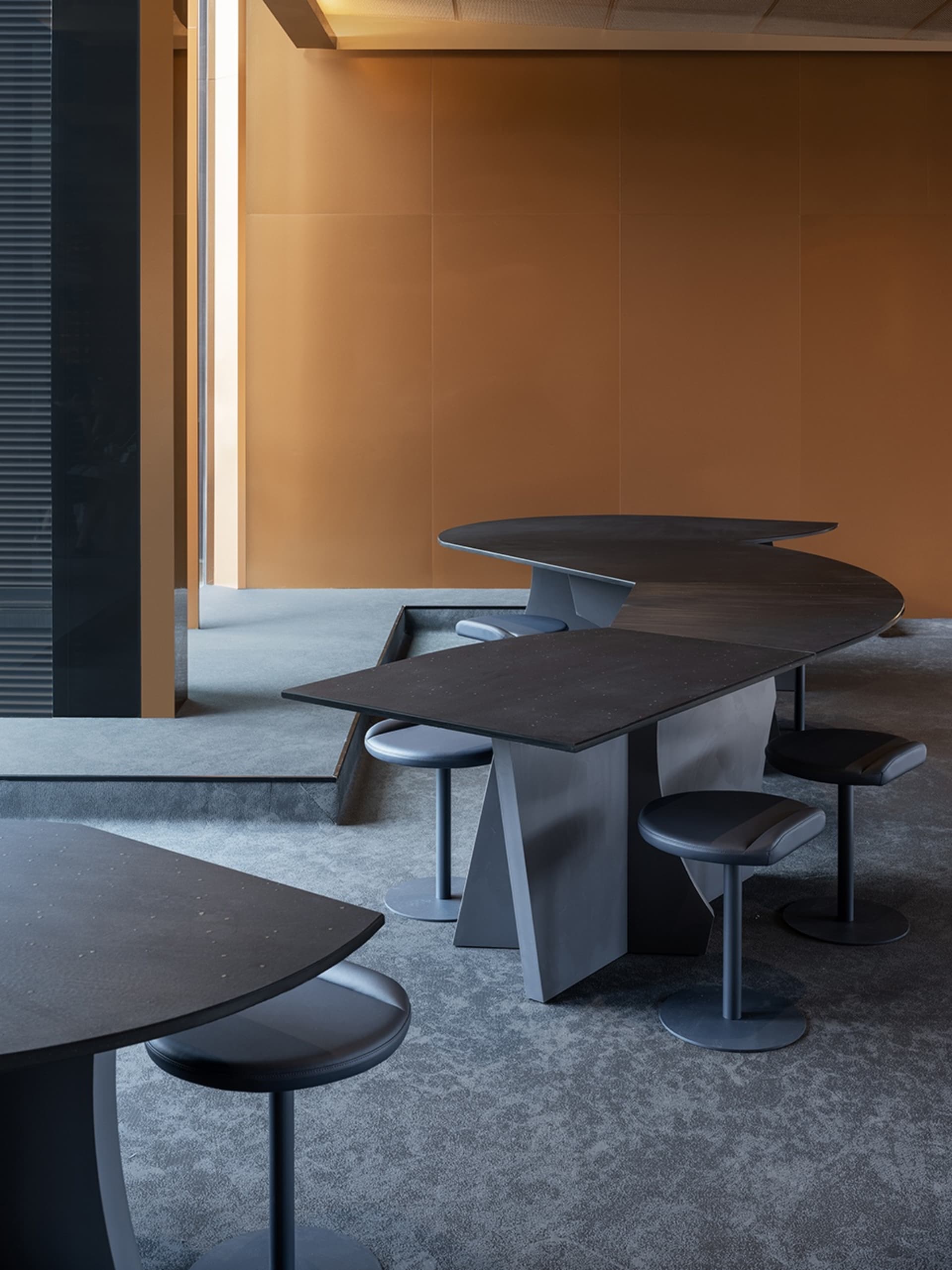 Inviting restaurant interior with wood and metal elements, featuring multiple dining tables and chairs in a modern and stylish setting