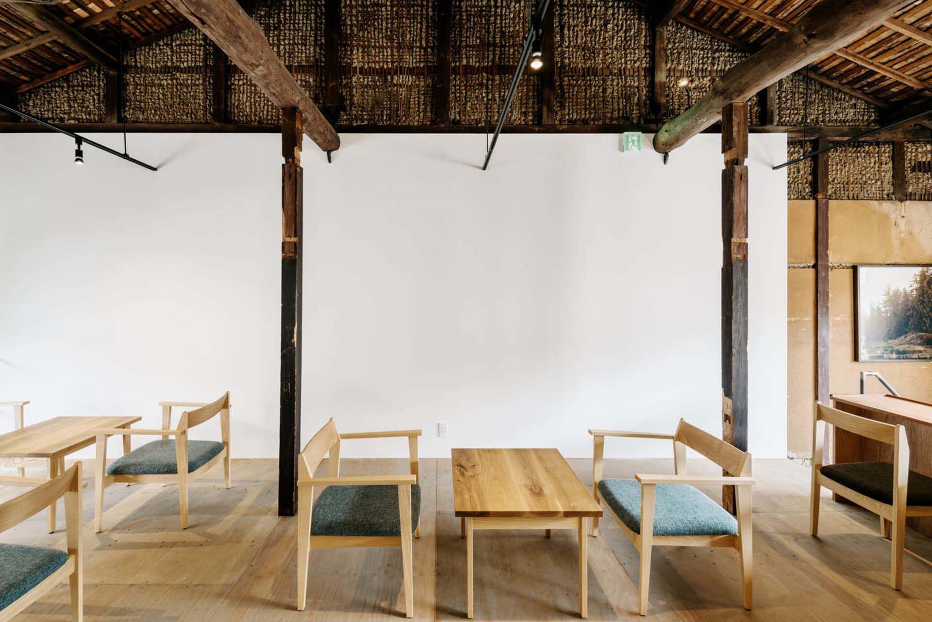 A warm and inviting dining space with a wooden table and chairs, perfect for social gatherings or meals