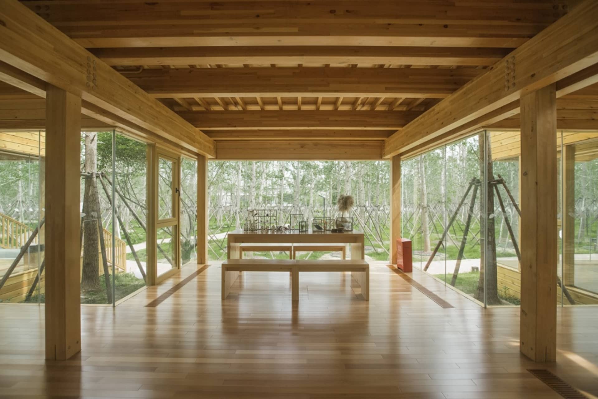 Rustic dining space with a wooden table and chairs in a cozy cabin or lodge setting