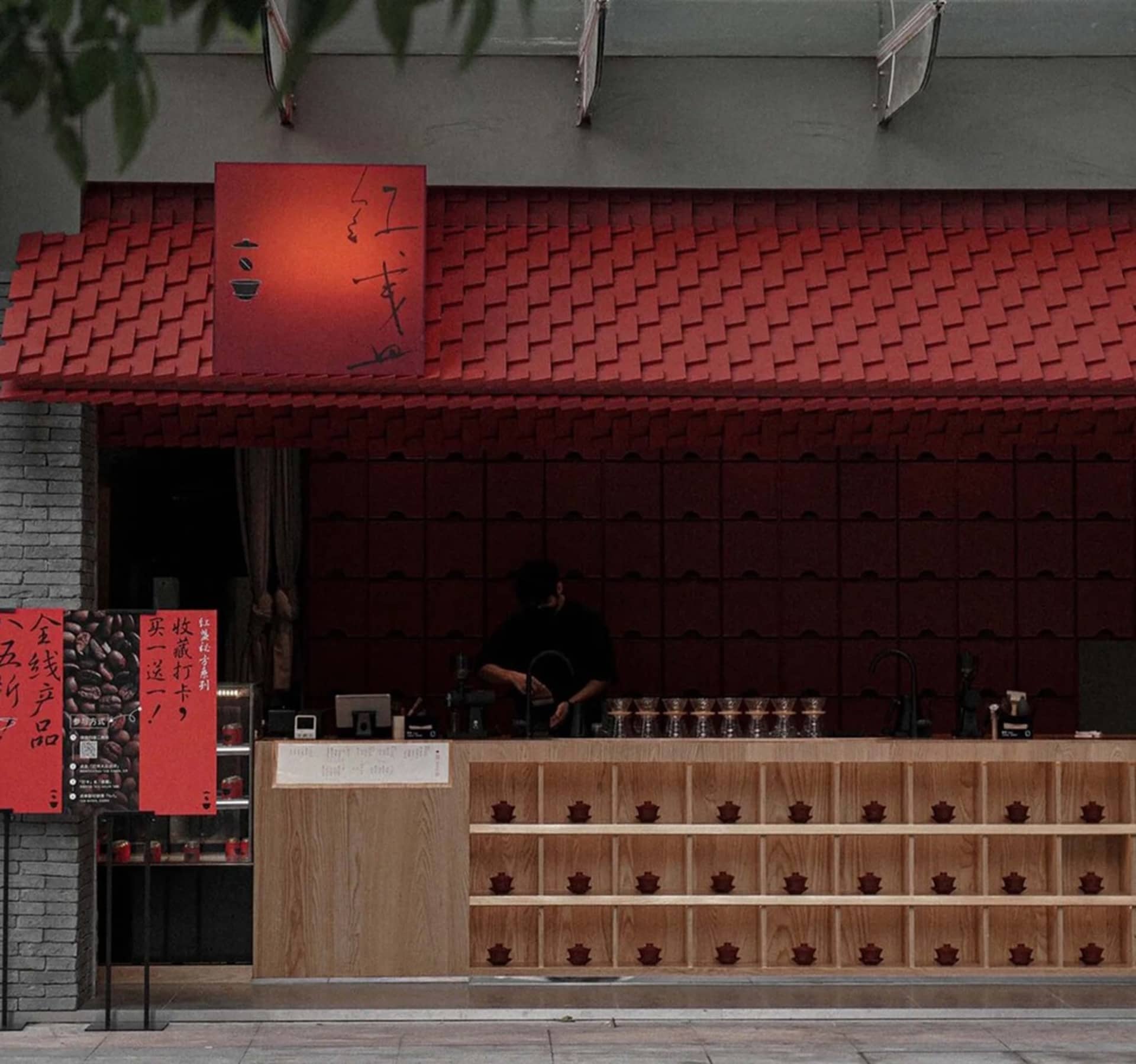 Cozy Asian restaurant with red walls, wooden elements, and traditional decorations, featuring a warm and inviting atmosphere