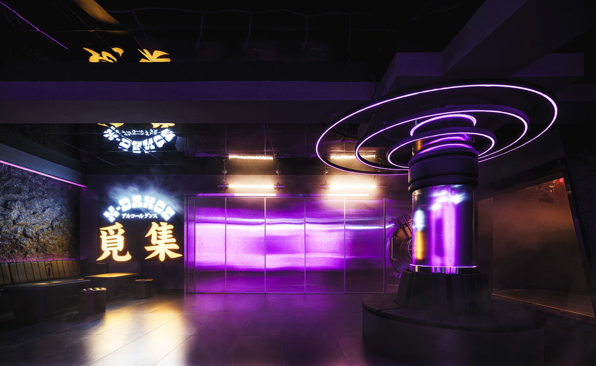A surreal cityscape with a large purple structure surrounded by smaller purple objects, set against a dreamlike atmosphere