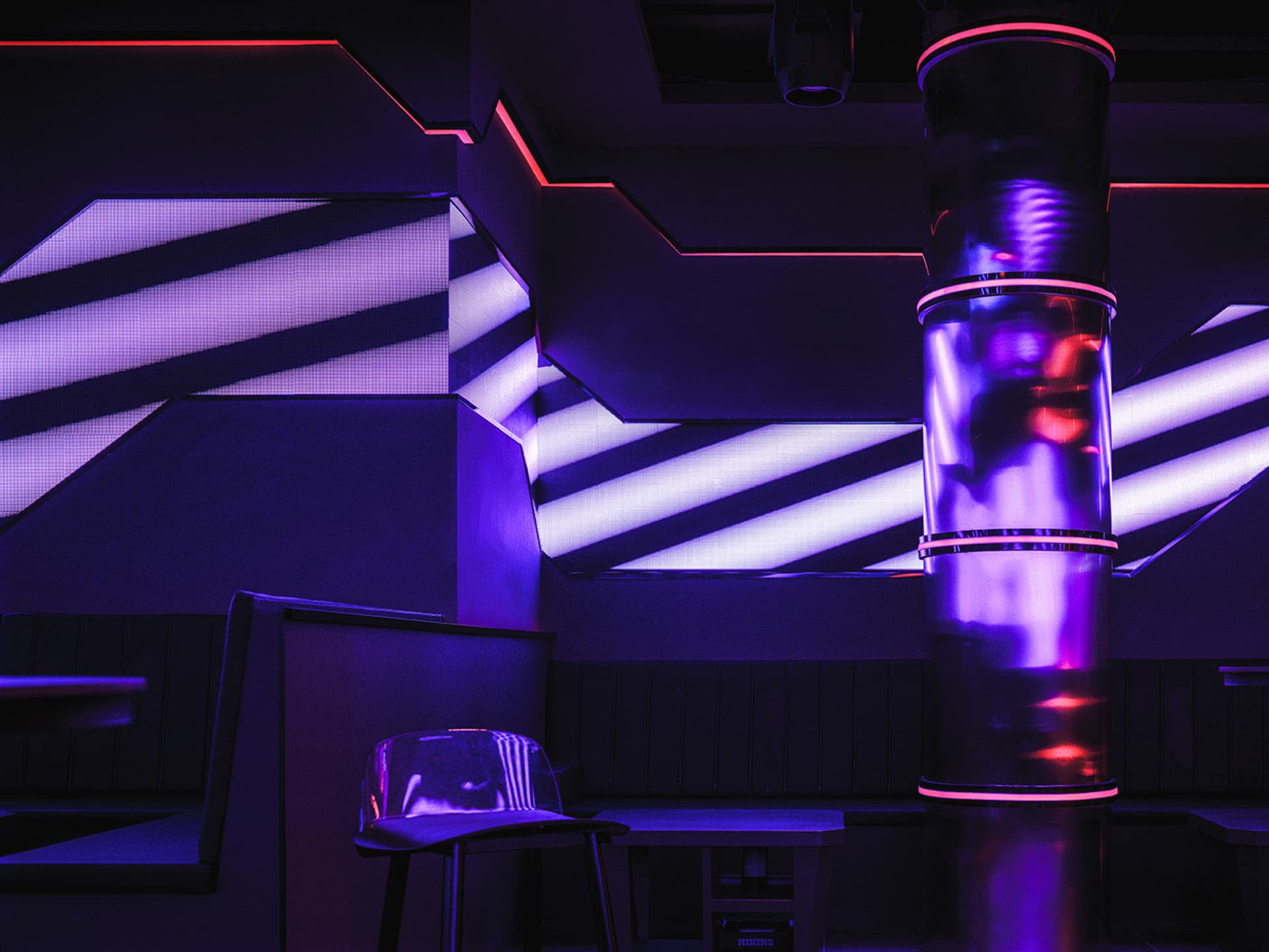 A modern bar area with purple striped walls, a dining table, and two chairs, creating a unique atmosphere