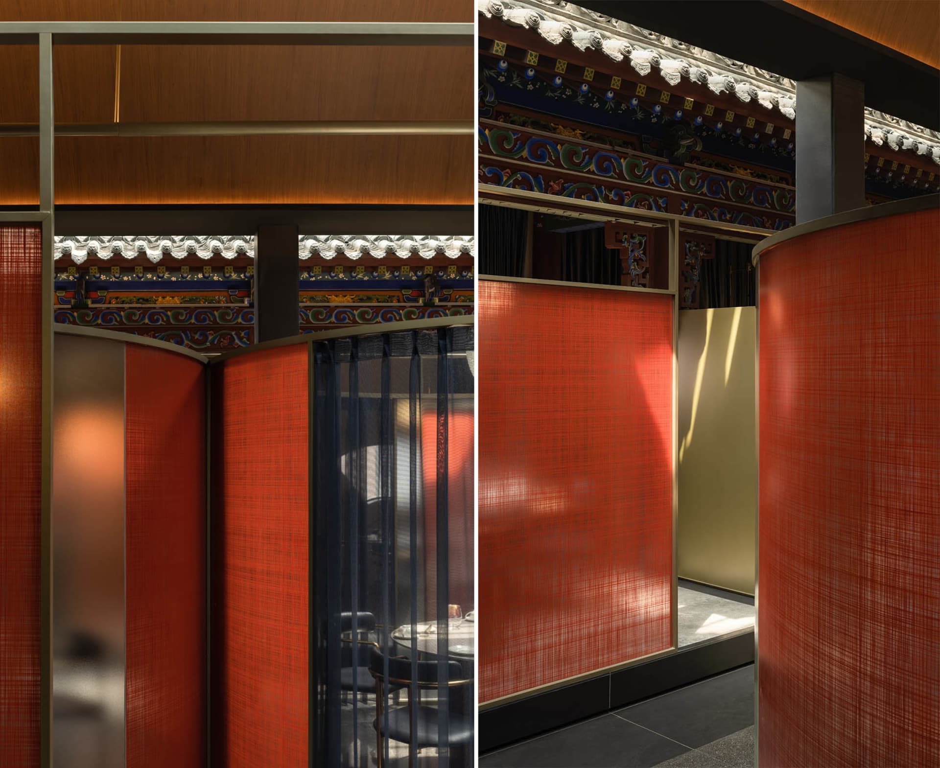Dining area with tables and chairs in an Asian restaurant featuring red and gold walls, orange curtains, and decorative vases