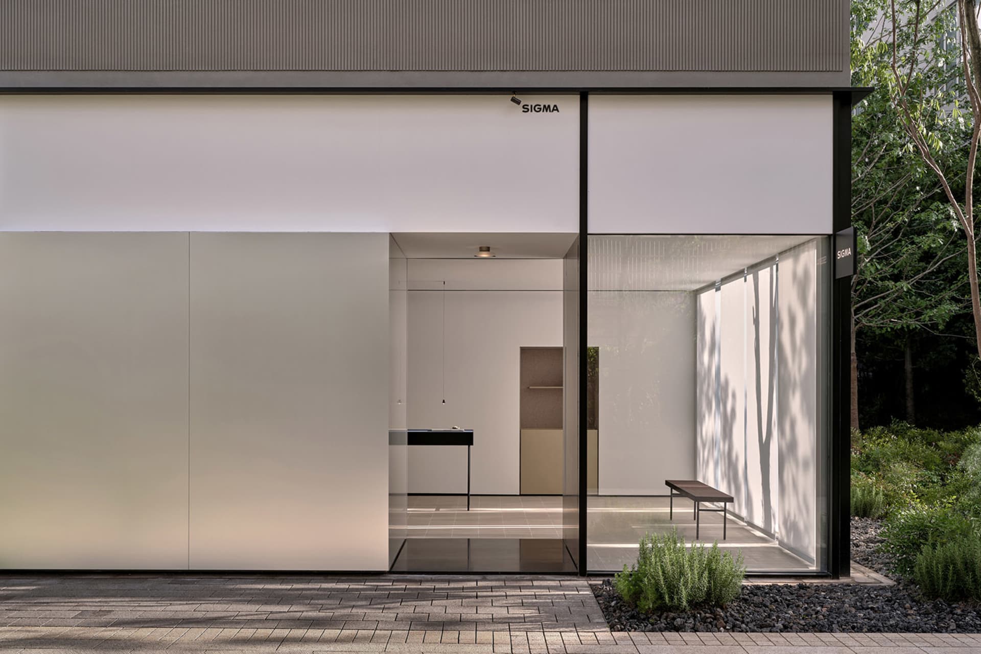 A modern kitchen with two sinks, a dining table, and chairs, surrounded by clean and well-organized space with a focus on functionality and modern design elements