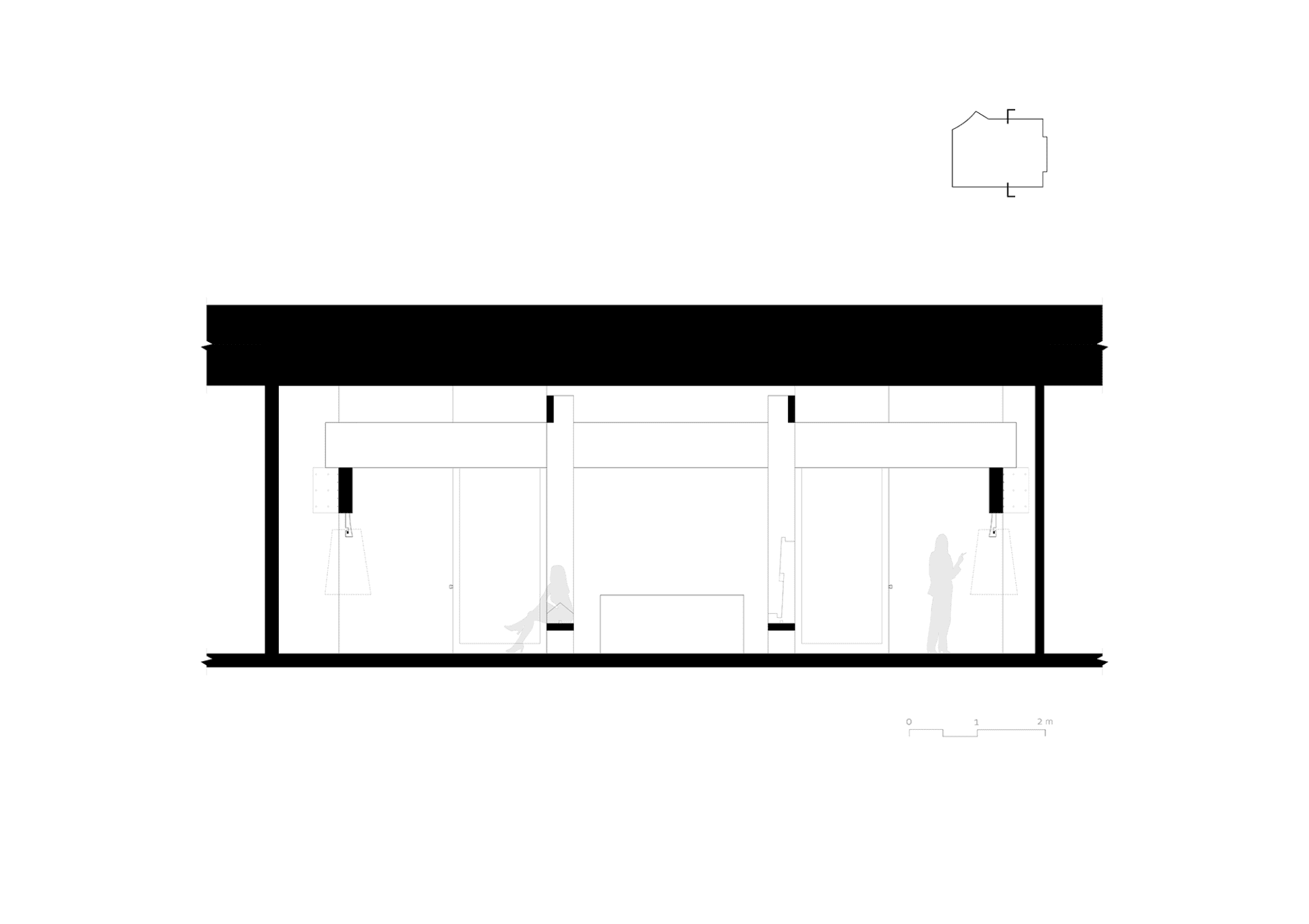 A spacious office space with natural light, featuring three individuals walking around, with a warm and inviting atmosphere