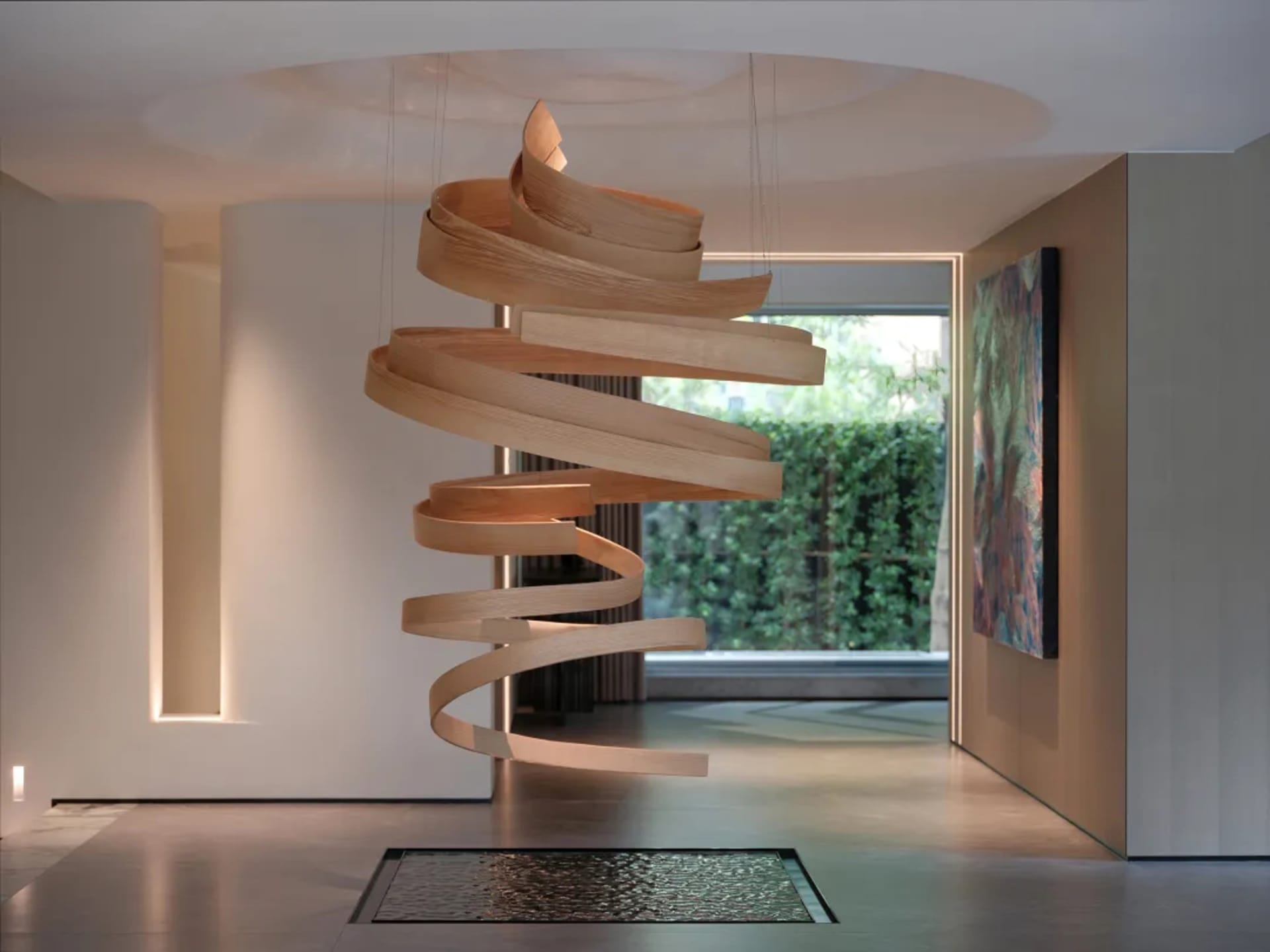 Open living space with a large wooden spiral staircase as the focal point, conveying a sense of spaciousness and elegance