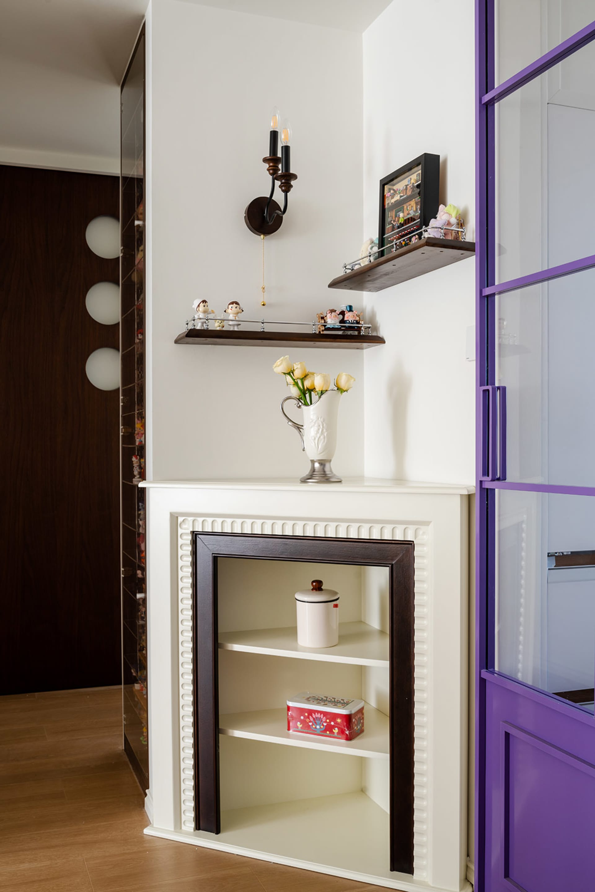 Cozy living space with a fireplace mantel, vases, and figurines, creating a warm and inviting atmosphere