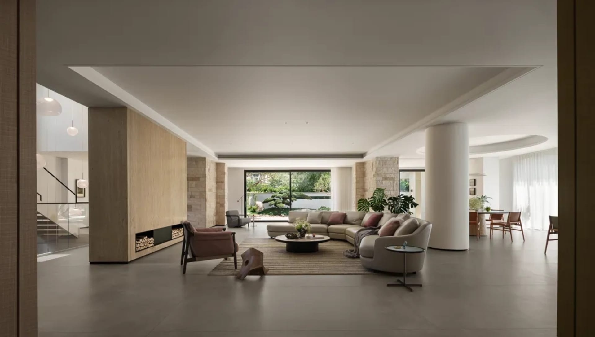 Bright and inviting living area with white interior, two couches, a chair, dining table, and potted plants