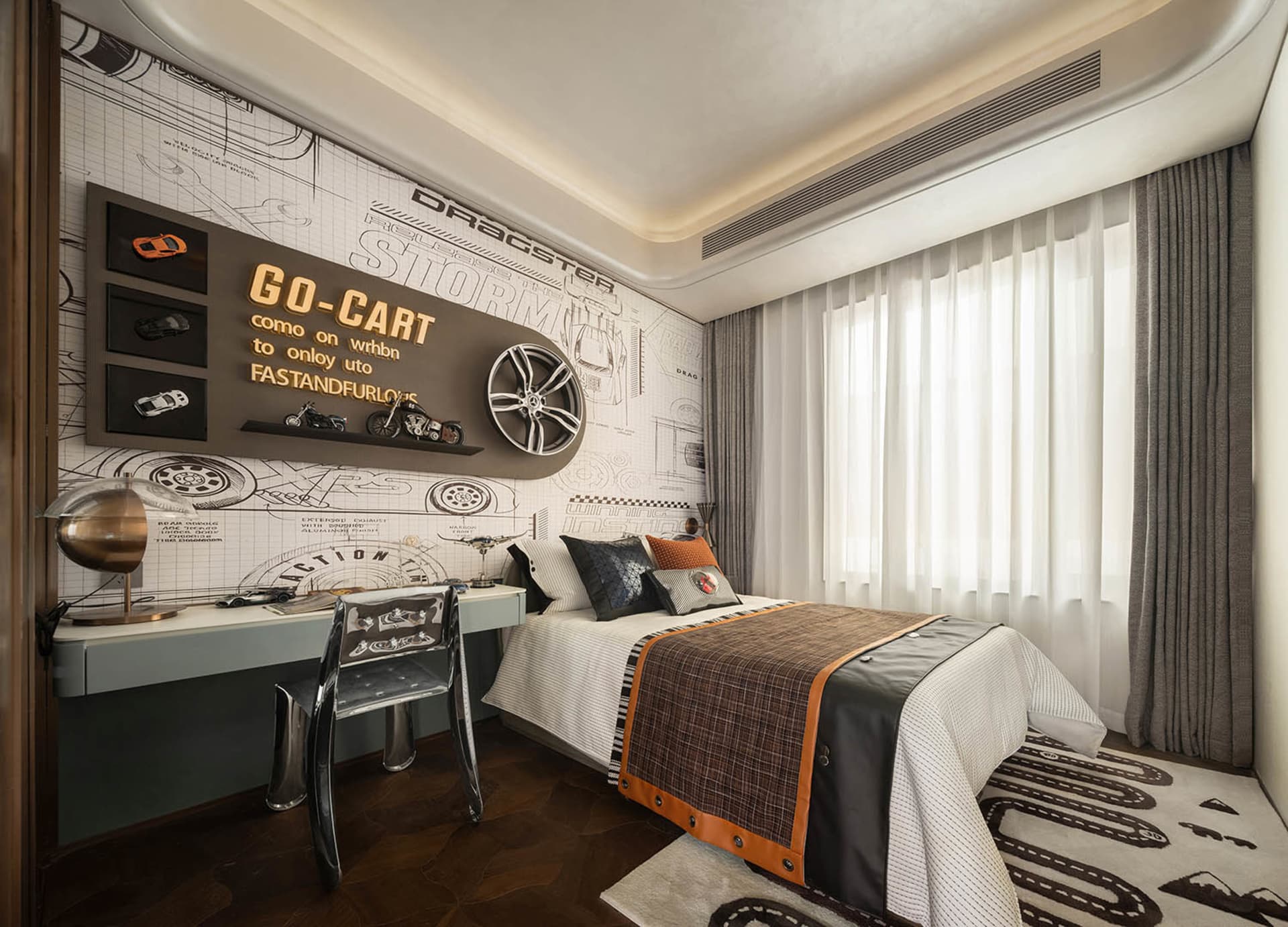 Cozy bedroom with a central bed, two chairs, a desk, dining table, and a couch, with a clock above the desk