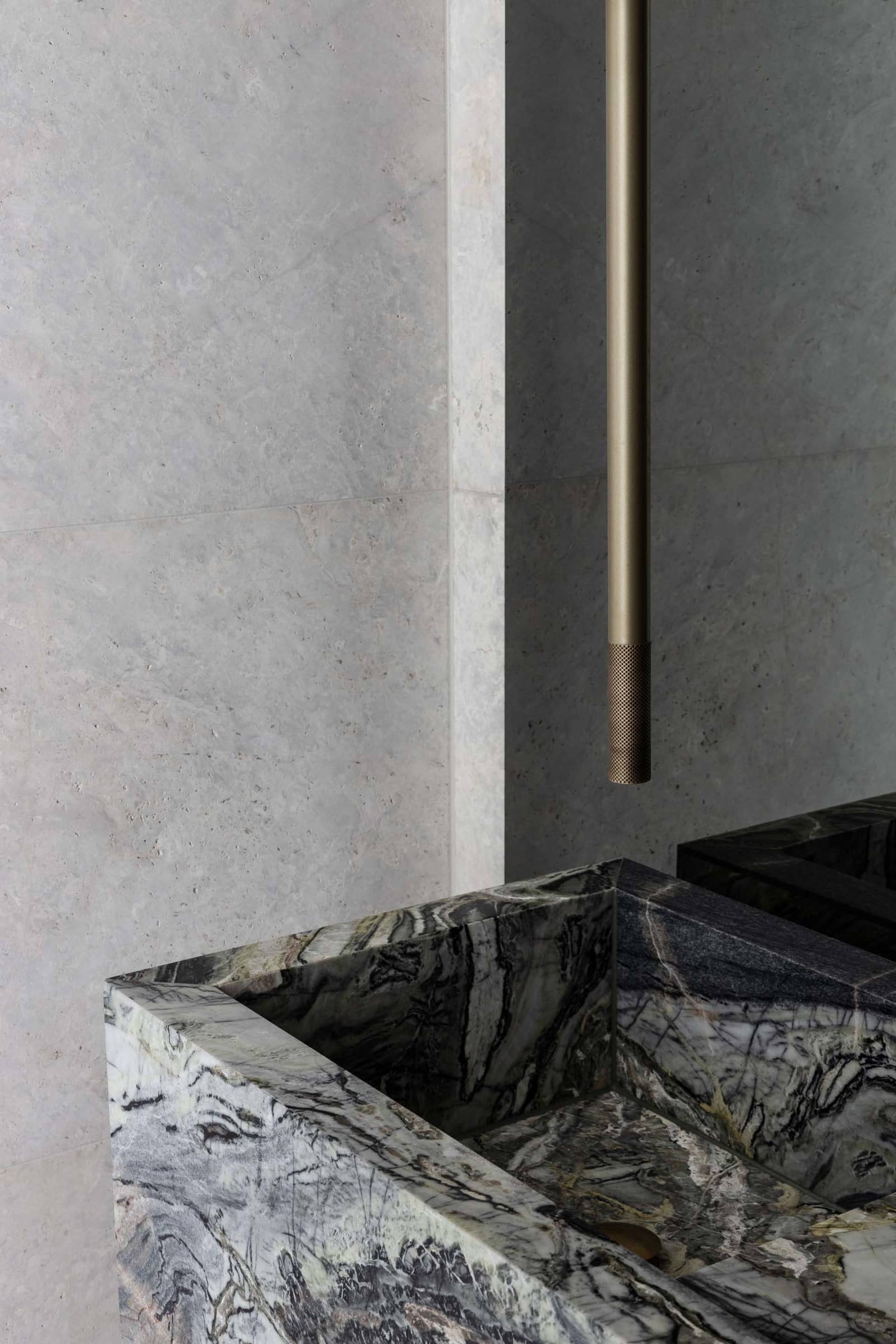 Double sink bathroom with marble countertops, white walls, and ample space for multiple users