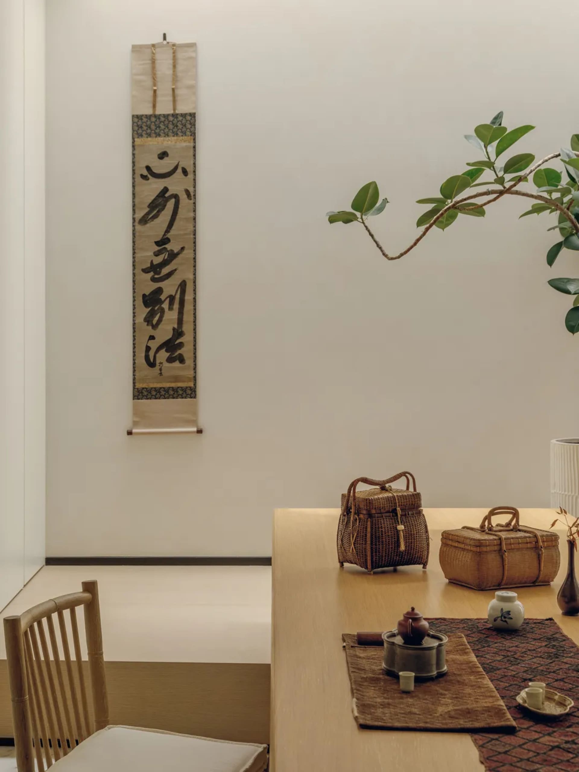 A warm and inviting dining area with a wooden table and chairs, set with various items and surrounded by a cozy atmosphere
