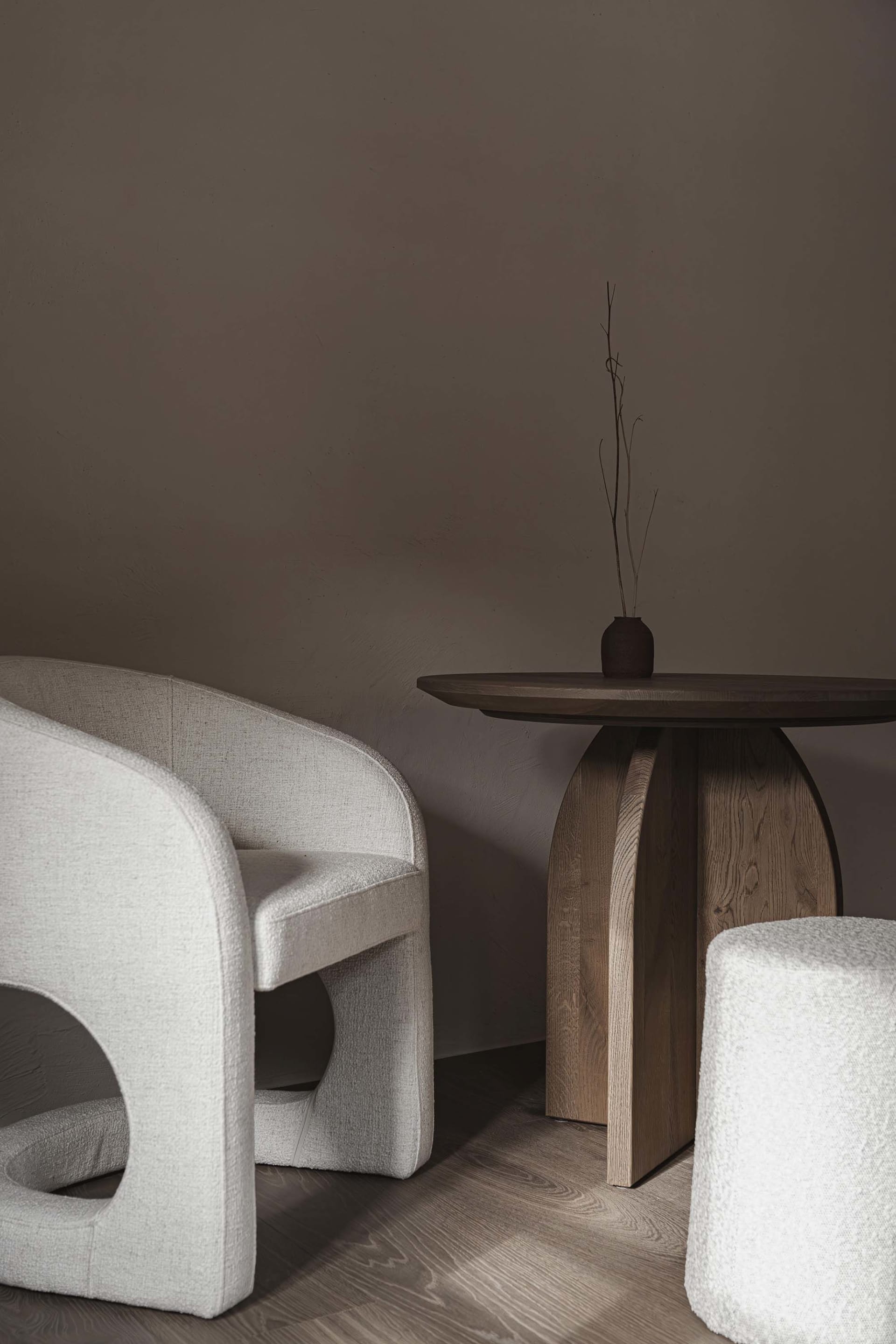 A cozy living space with a wooden table and two chairs, surrounded by a warm and inviting atmosphere