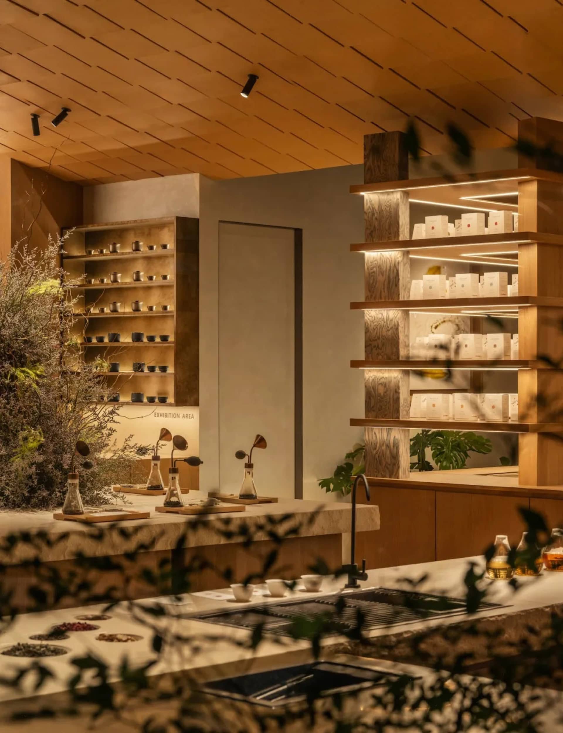 A modern kitchen with a wooden counter and cabinets, featuring a variety of items and a cozy atmosphere