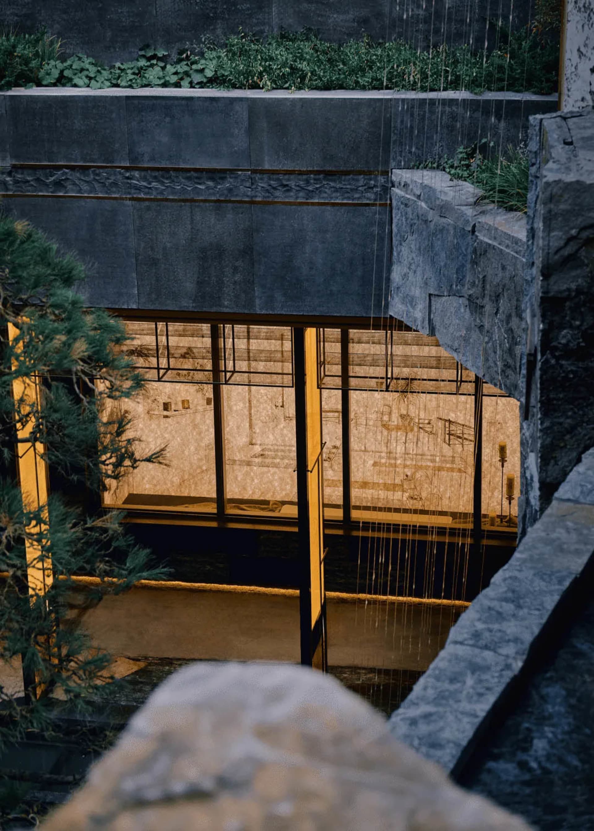 Large room with stone walls and stone floor, dim lighting creates a moody atmosphere