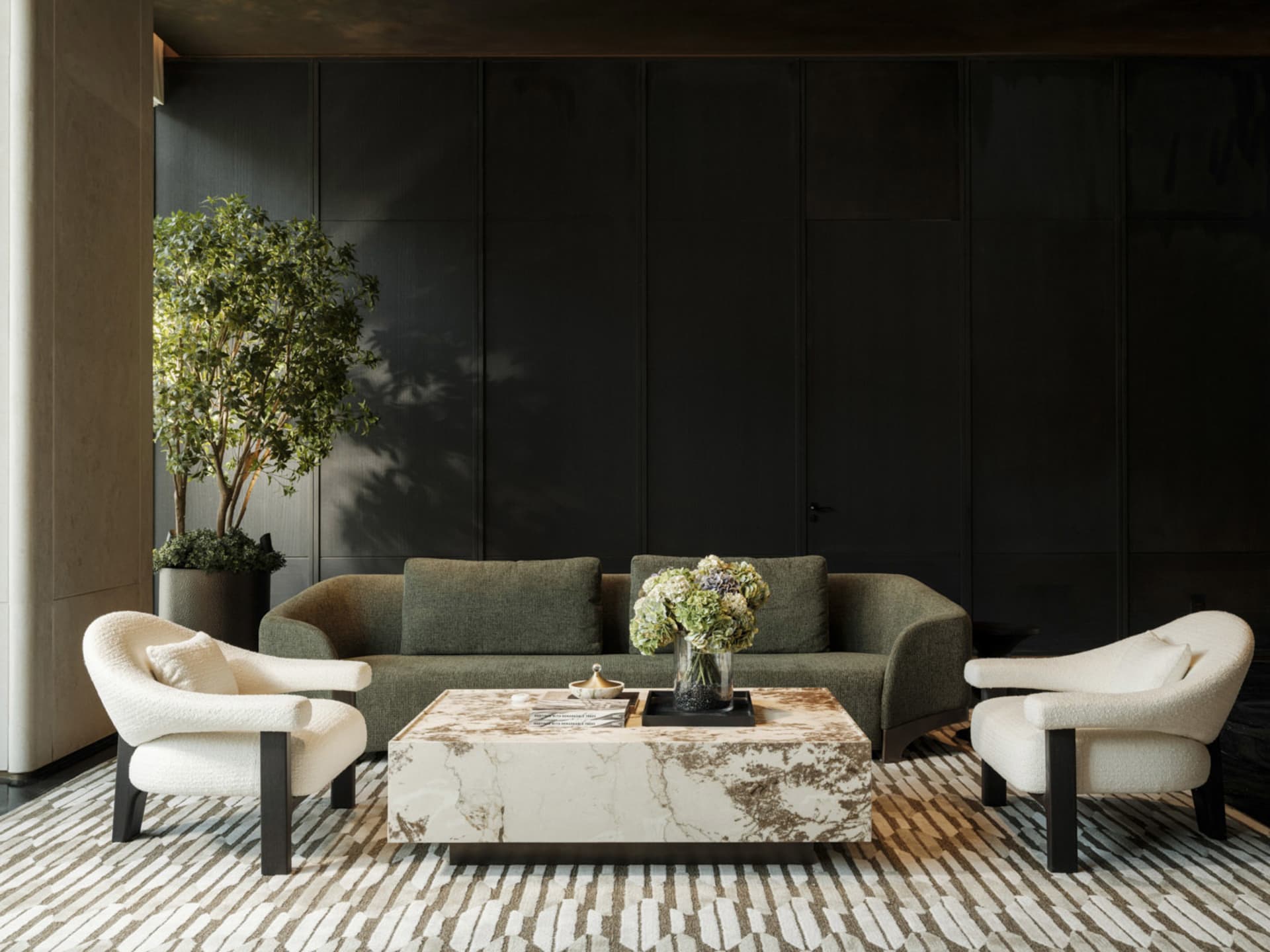 A modern living room with a black couch, chair, and coffee table, decorated with a vase and a book, and a potted plant in the corner, set against a black wall