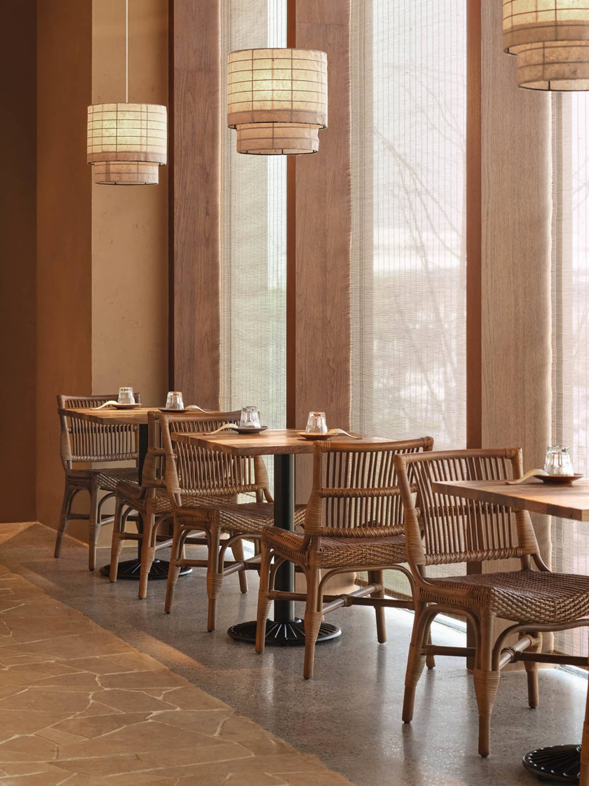 Cozy restaurant with wooden furniture, natural light, and a warm atmosphere