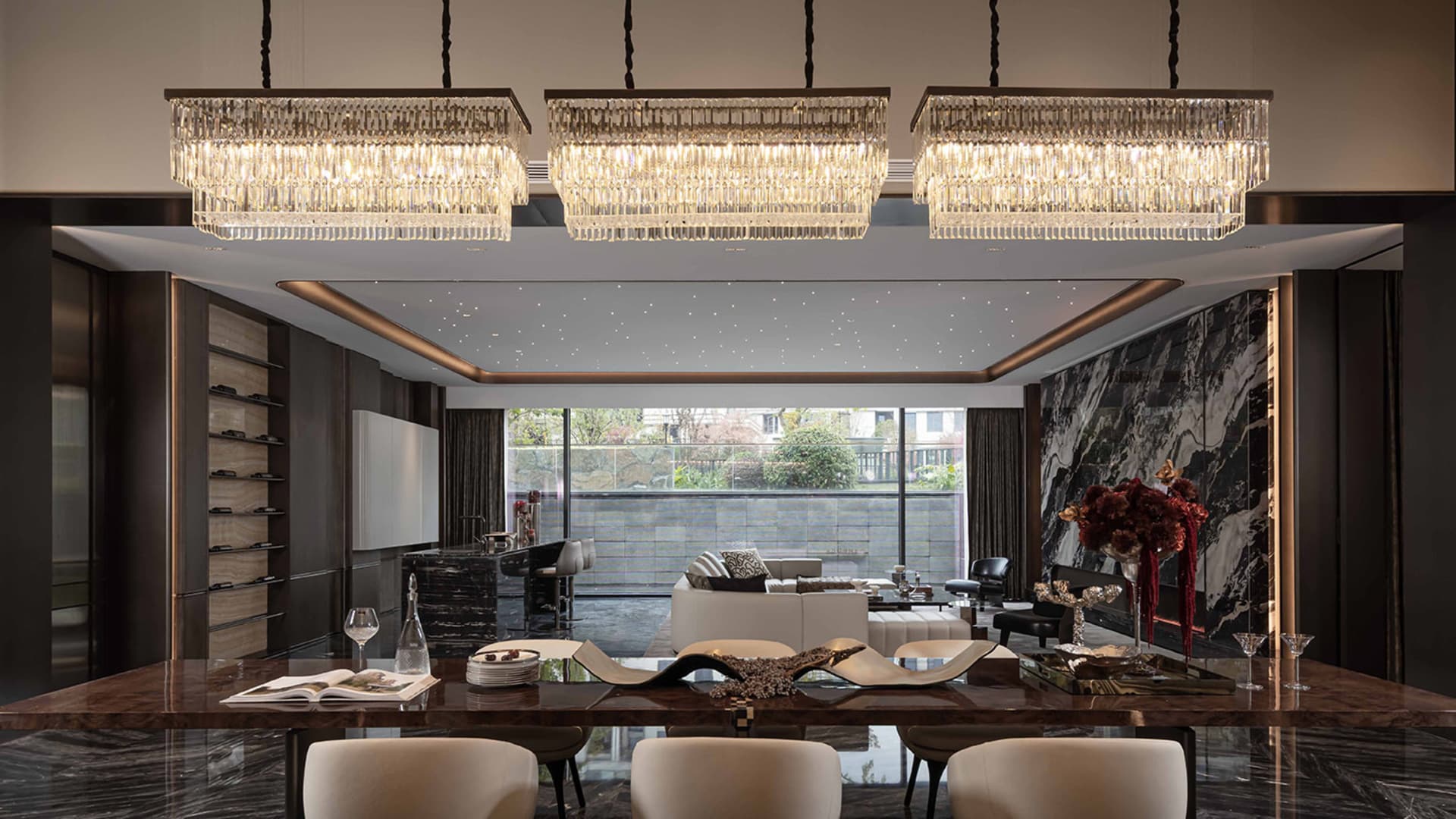 Luxurious living room with a dining area, kitchen, and comfortable seating, featuring wood and glass materials and natural light