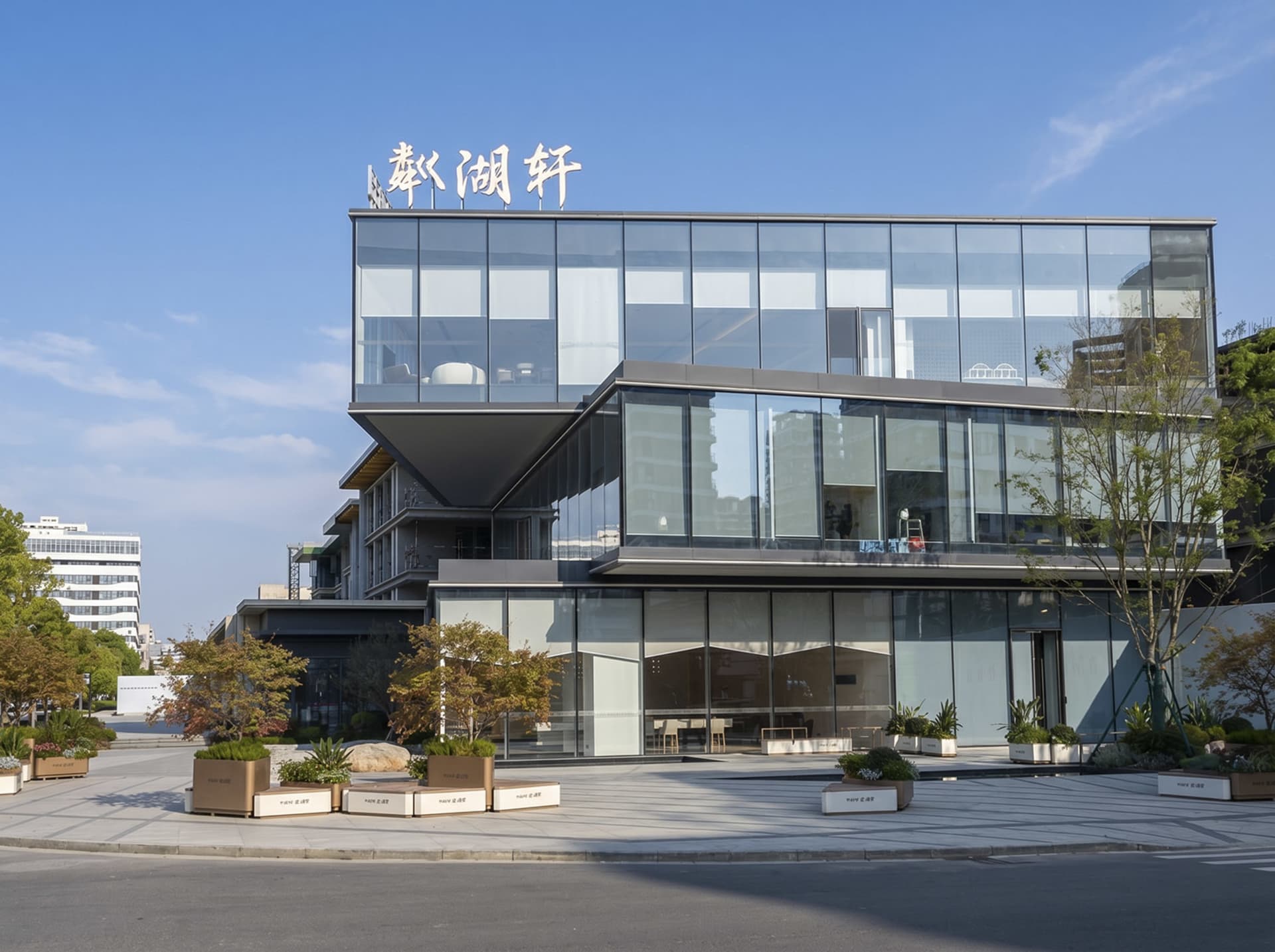 Sleek modern building with glass walls, potted plants, and a mix of indoor and outdoor elements