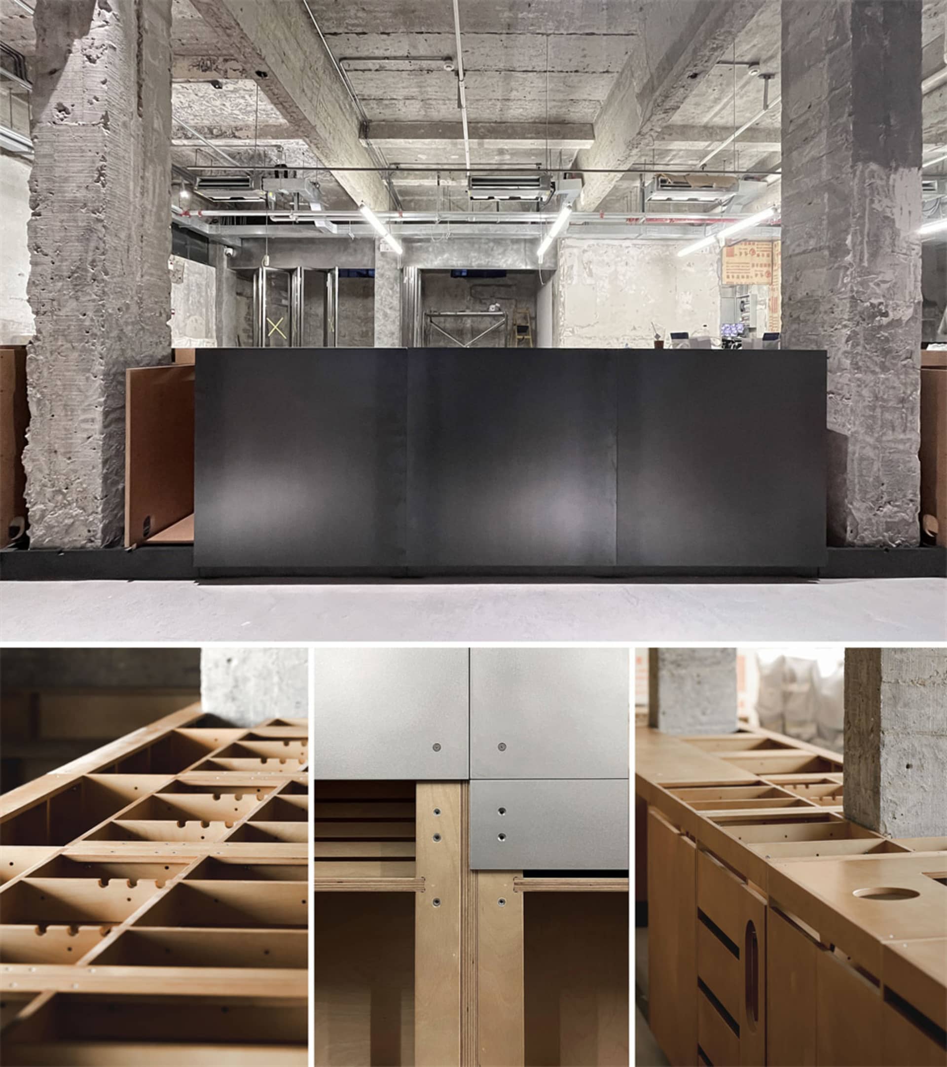 A modern living space with a wooden desk, black counter, and metal refrigerator, featuring a warm and inviting atmosphere with a combination of wood and metal materials