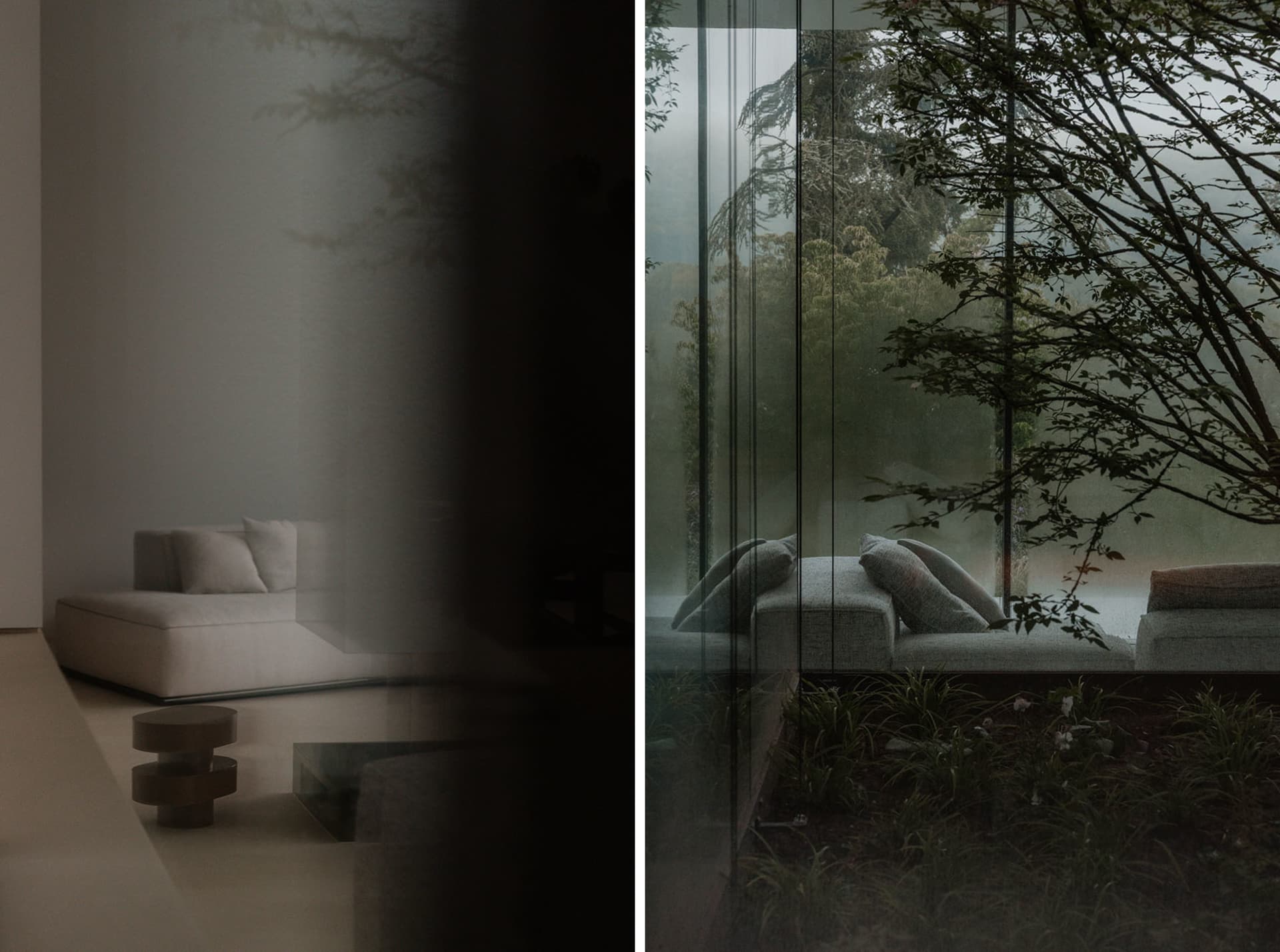 Dimly lit modern living room with a couch, chair, and potted plant, featuring a glass door and large window, with wood furniture and white upholstery