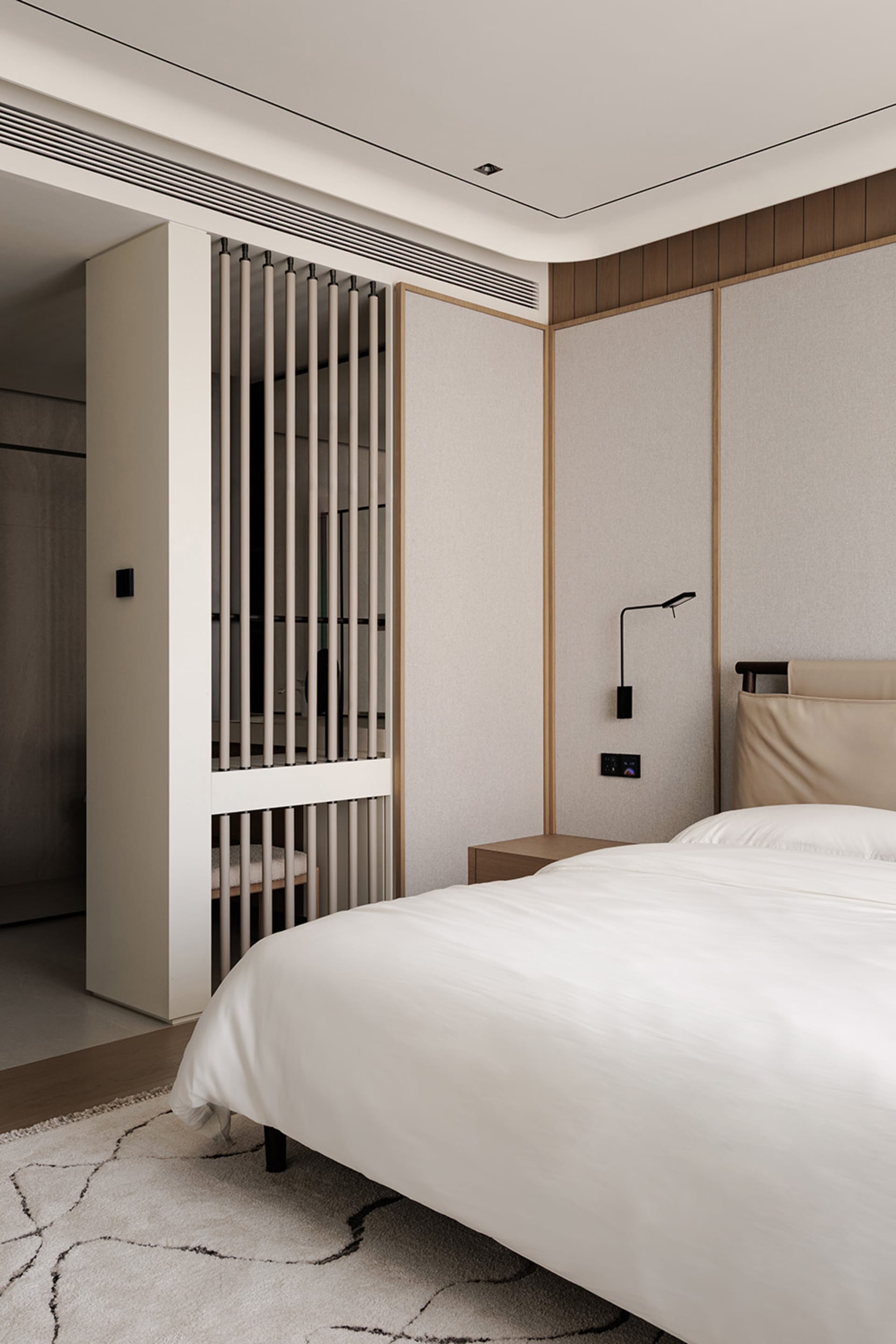 A modern bedroom with a bed, nightstand, and lamp, featuring white bedding and wood accents in a well-lit space