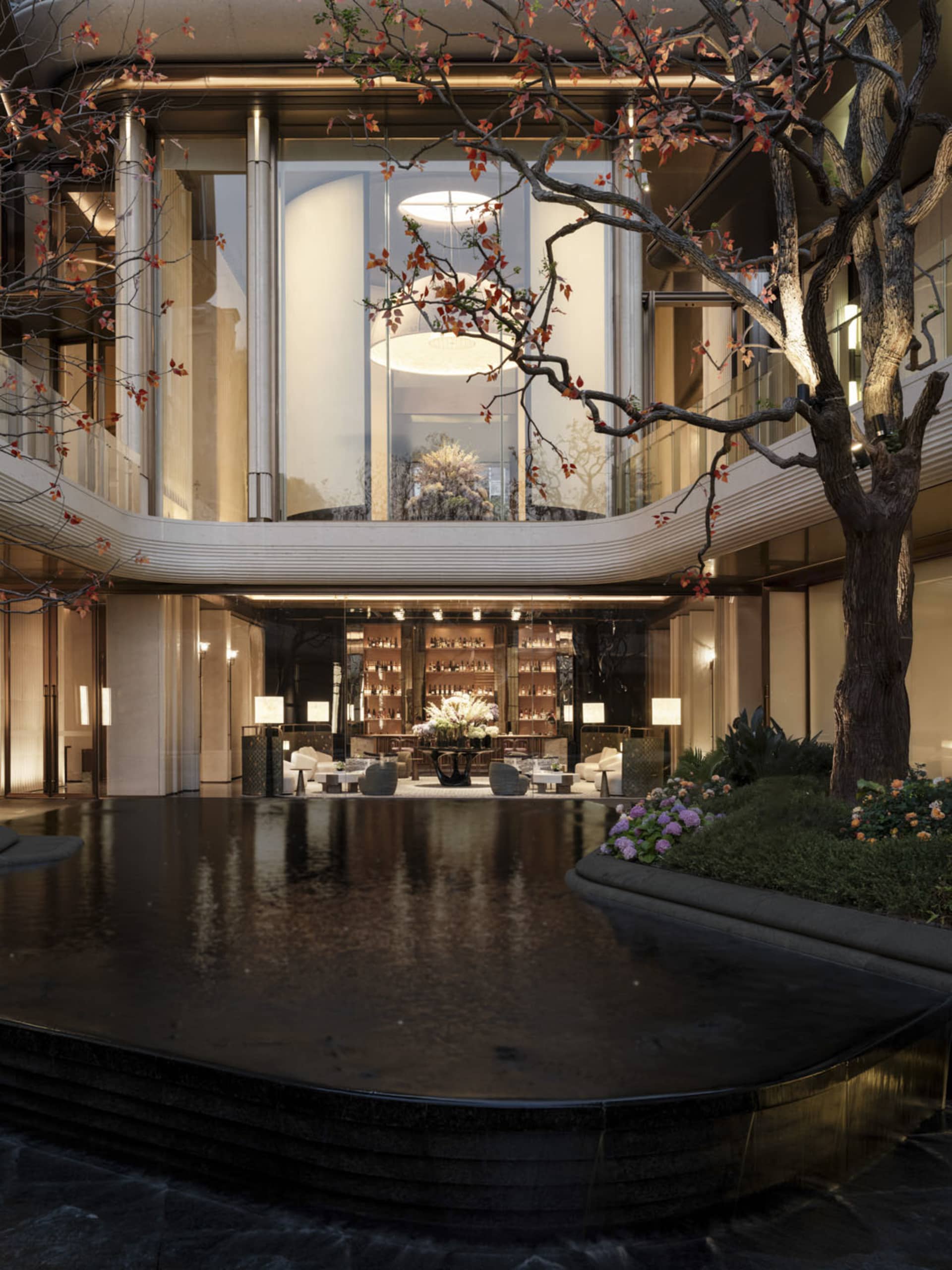 Bright and inviting office space with glass facade, atrium, and modern furniture