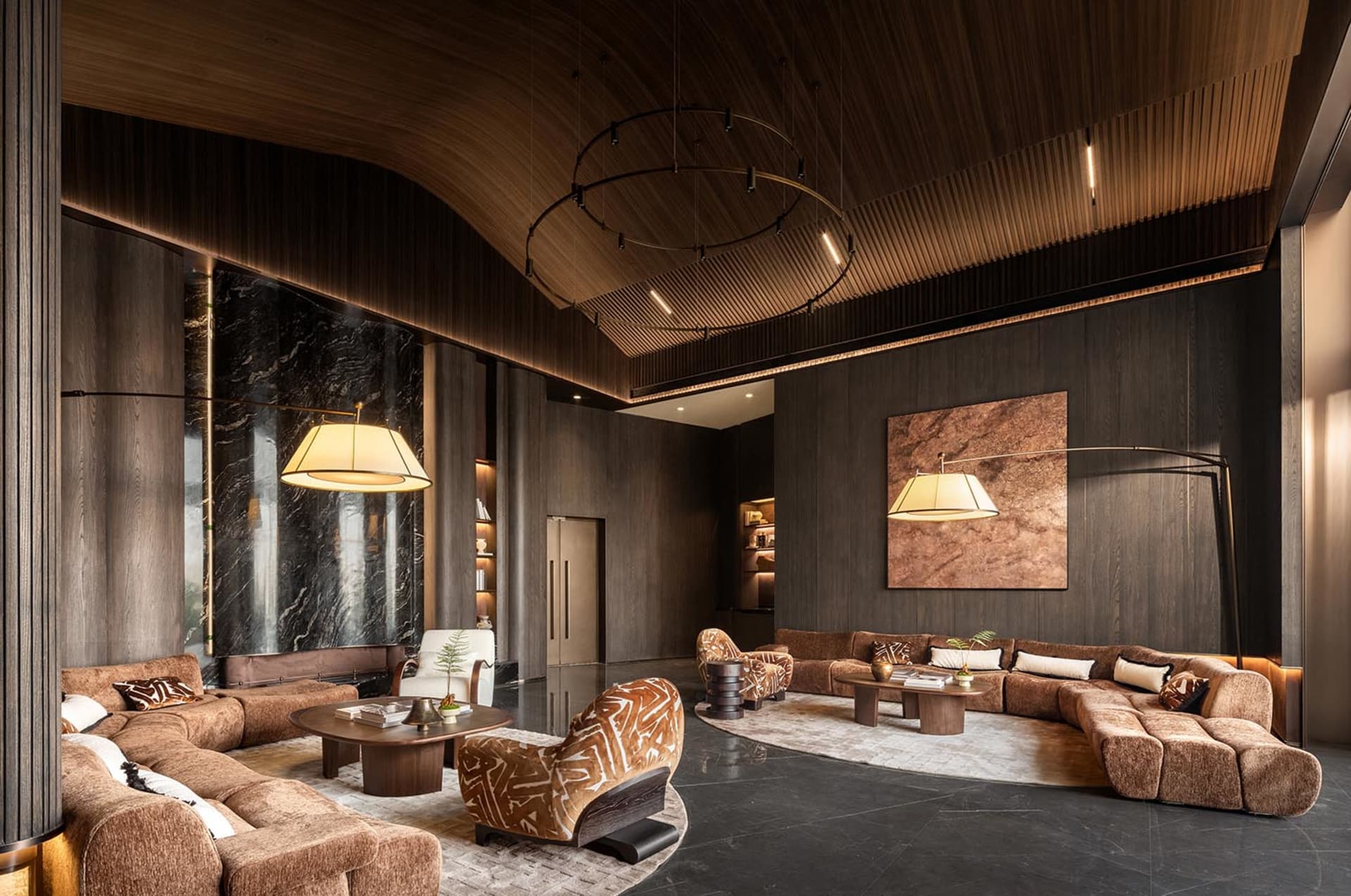 A modern living room with comfortable seating, potted plants, and dim lighting, featuring a contemporary design with clean lines and minimalistic style
