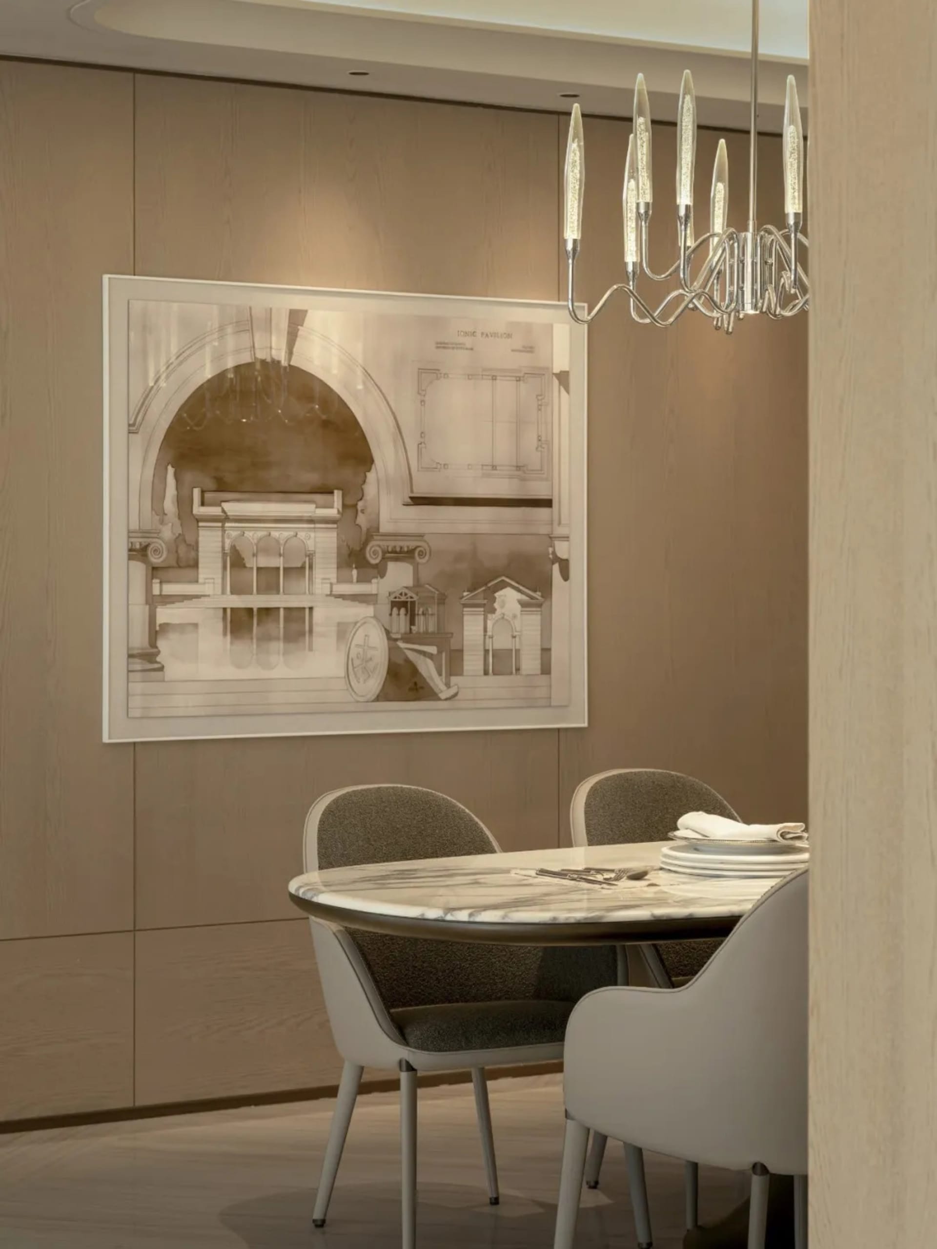 A well-lit dining room with a wooden table and chairs, surrounded by a large chandelier, creating a warm and inviting atmosphere