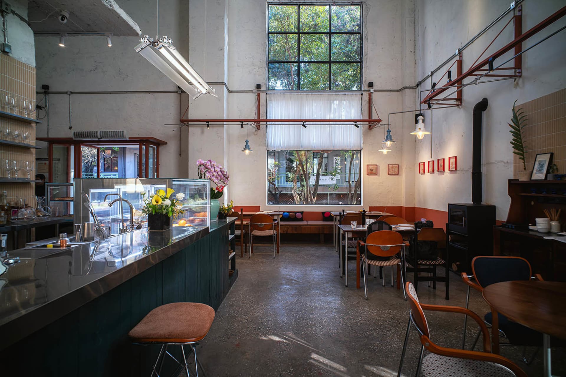 Cozy restaurant interior with wooden accents, metal details, and natural light from a window