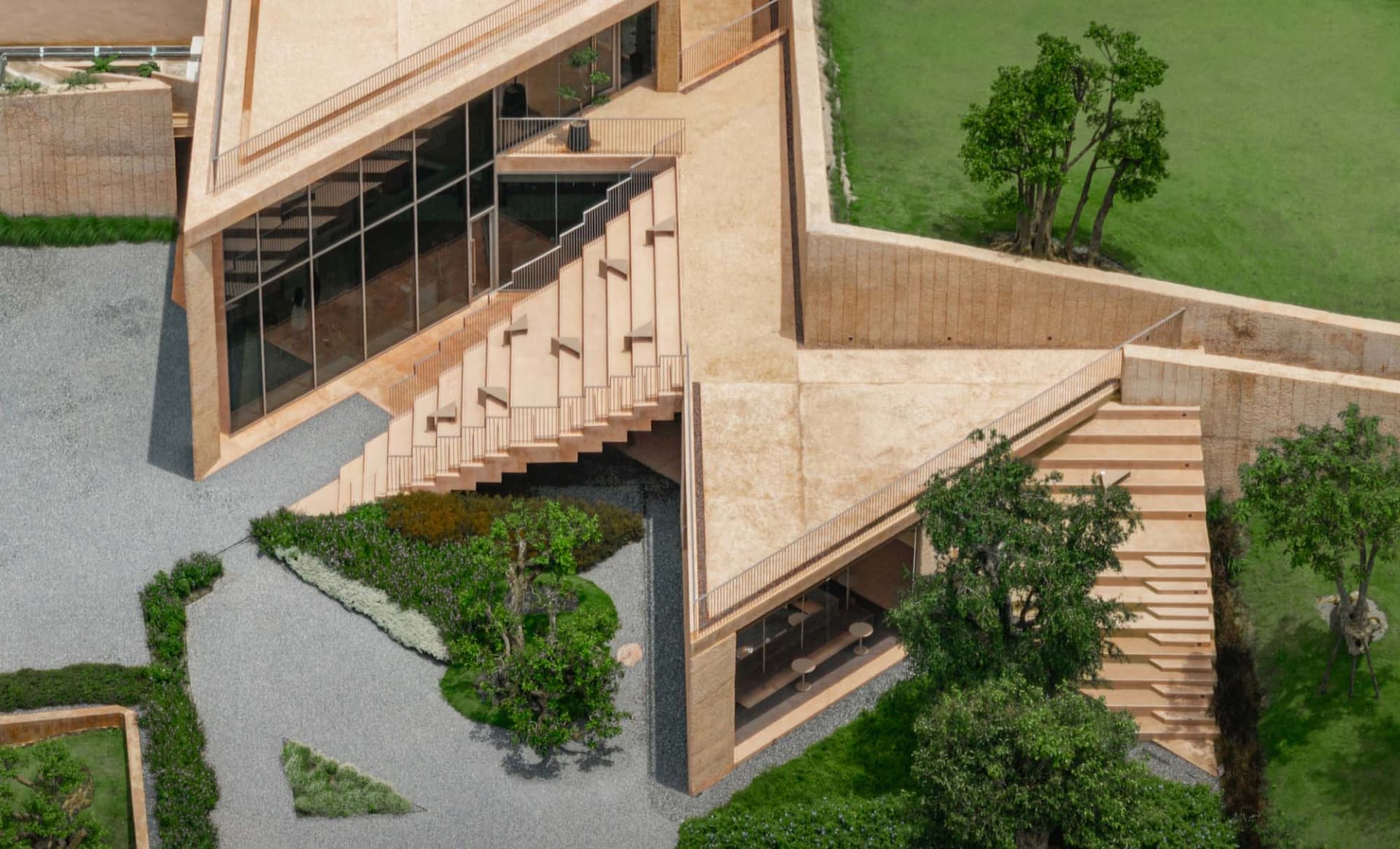 A modern house with a wooden staircase and a patio surrounded by greenery, featuring natural lighting and a stone exterior