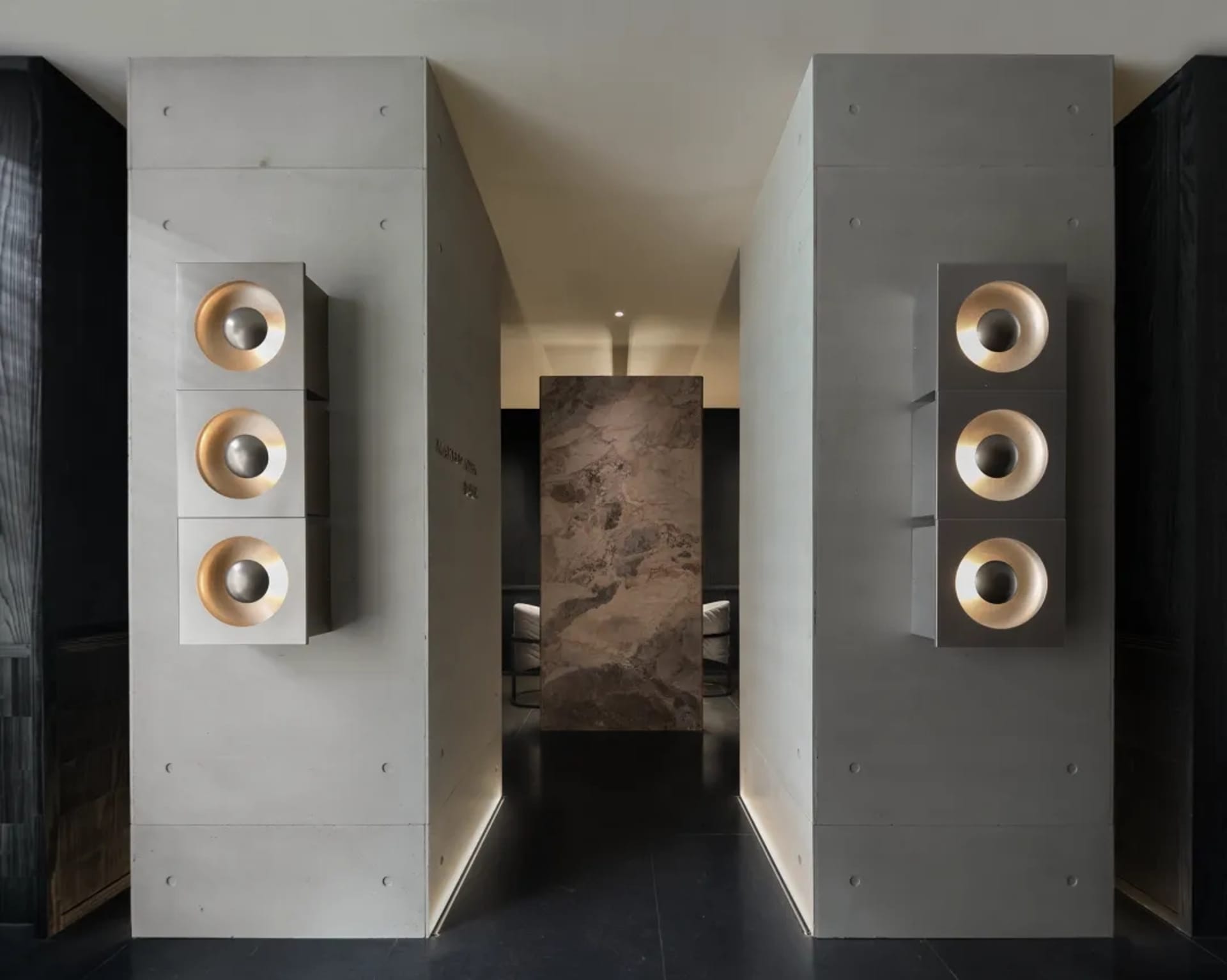 A modern living space with a stone wall and doorway, featuring bright lighting and a welcoming atmosphere