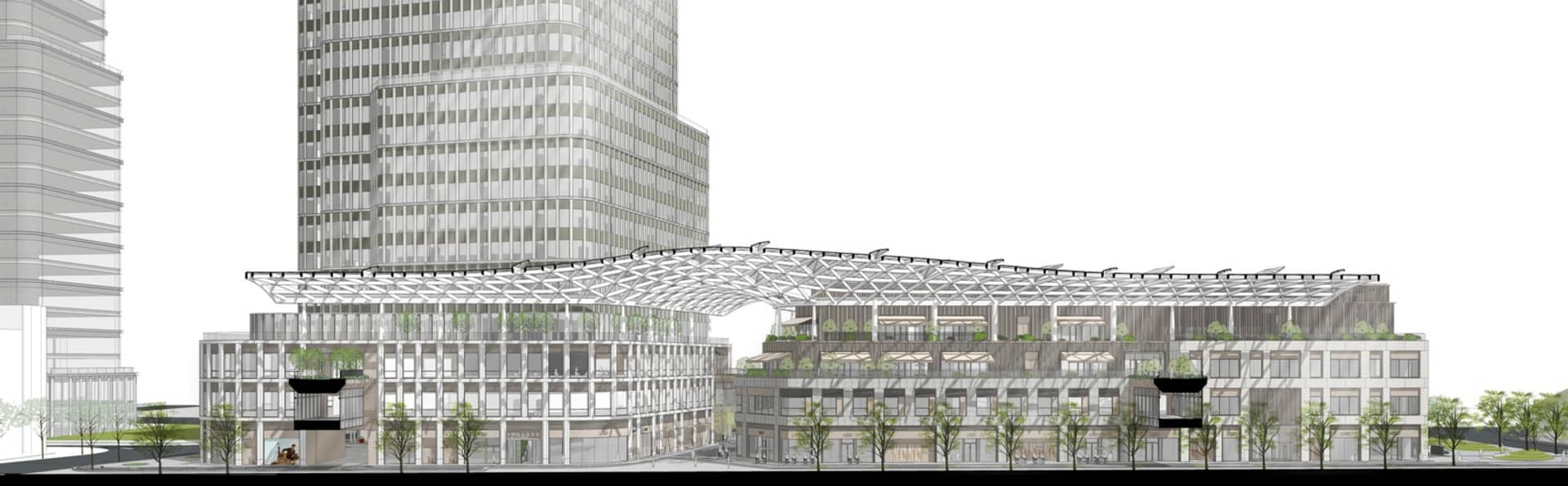 一座現代商業建築，配備大型玻璃屋頂，周圍環繞綠樹，营造寬敞開放的氛圍
