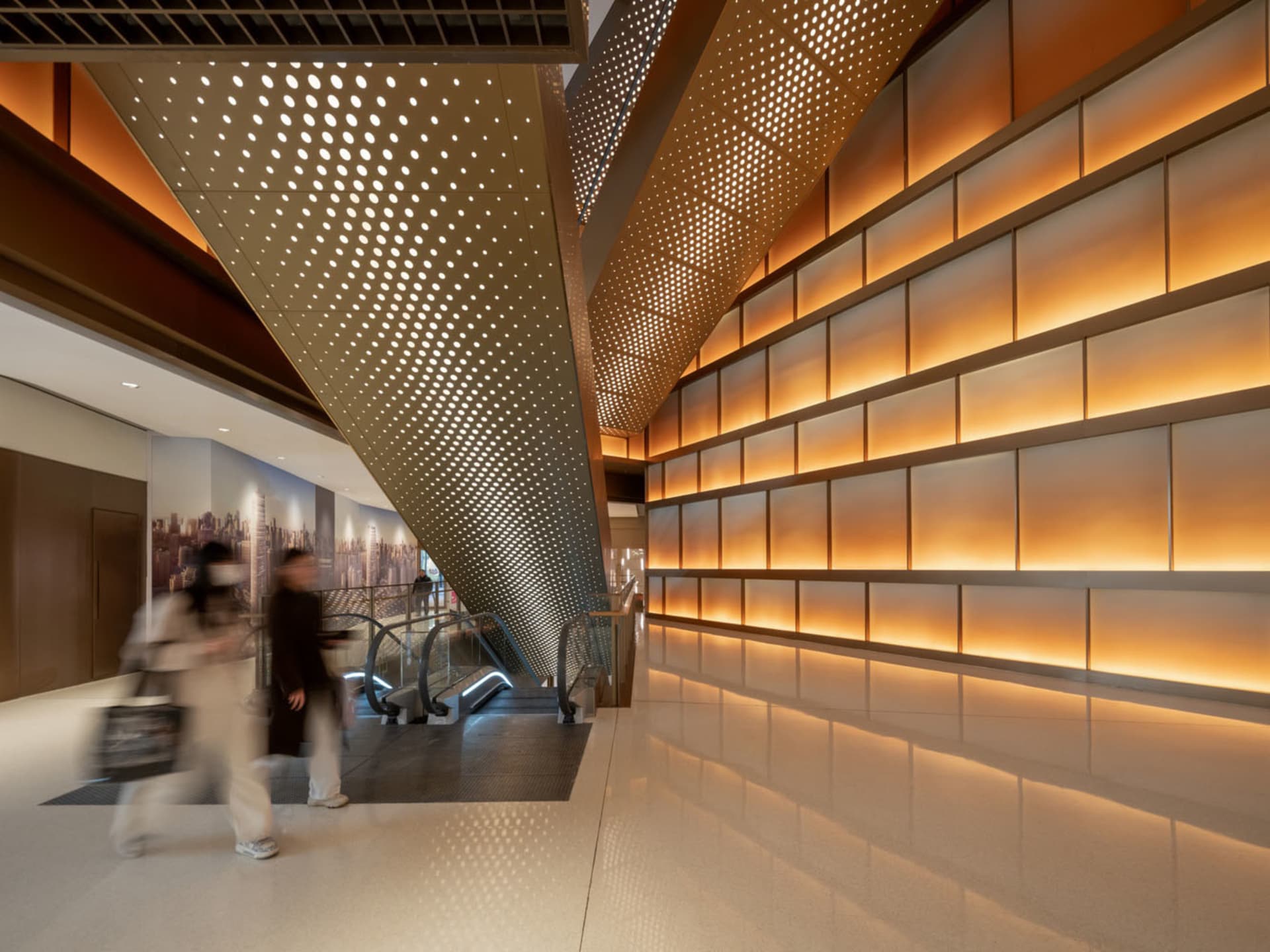 Modern office space with a glass ceiling, wood and glass walls, and natural light pouring in through the atrium