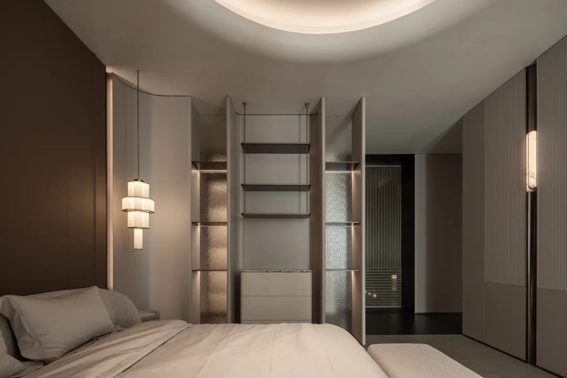 A well-lit bedroom with a white bed, a bookshelf, and a closet, creating a clean and bright atmosphere