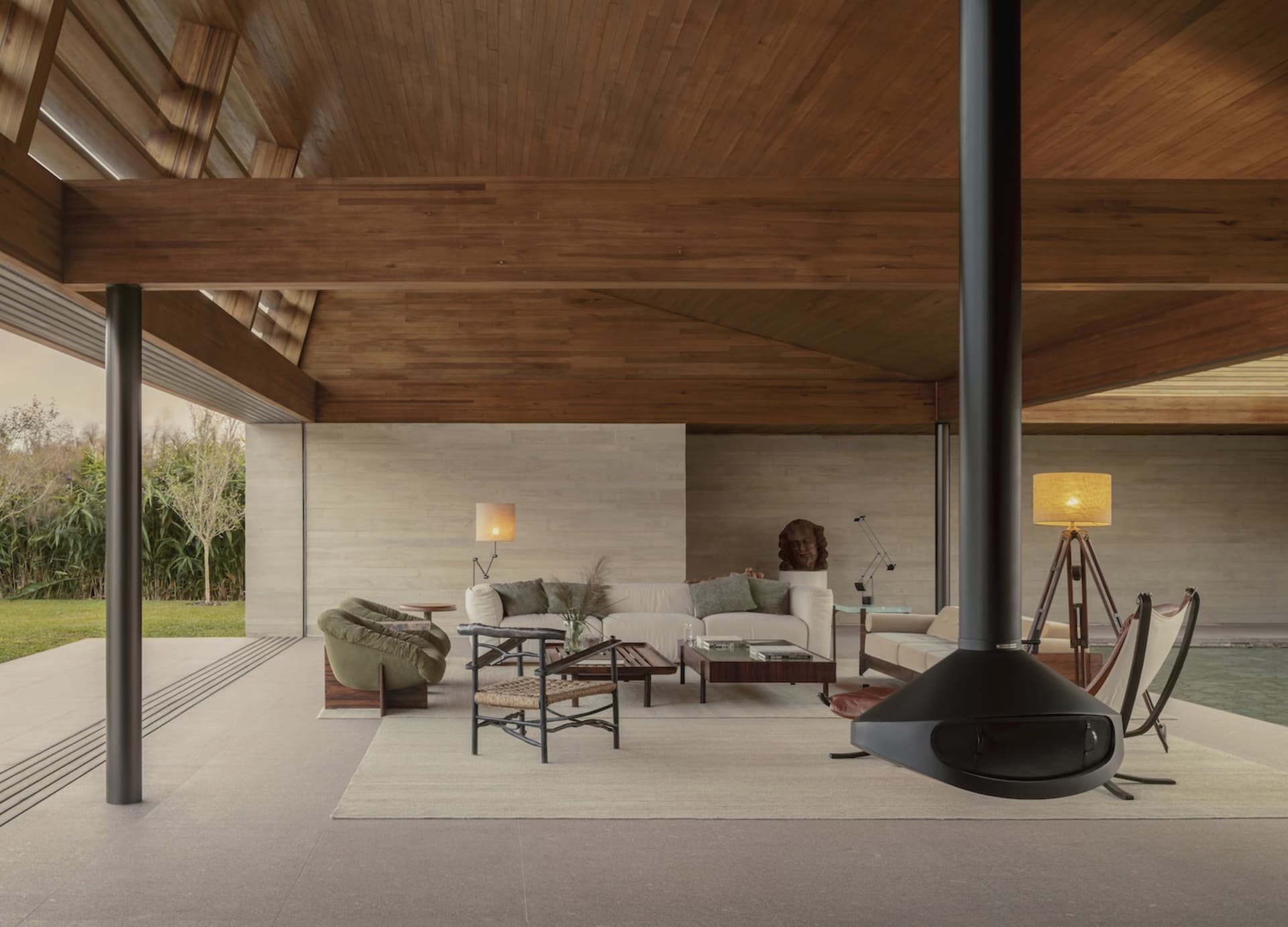 Cozy living space with a fireplace, modern furniture, and natural light from windows