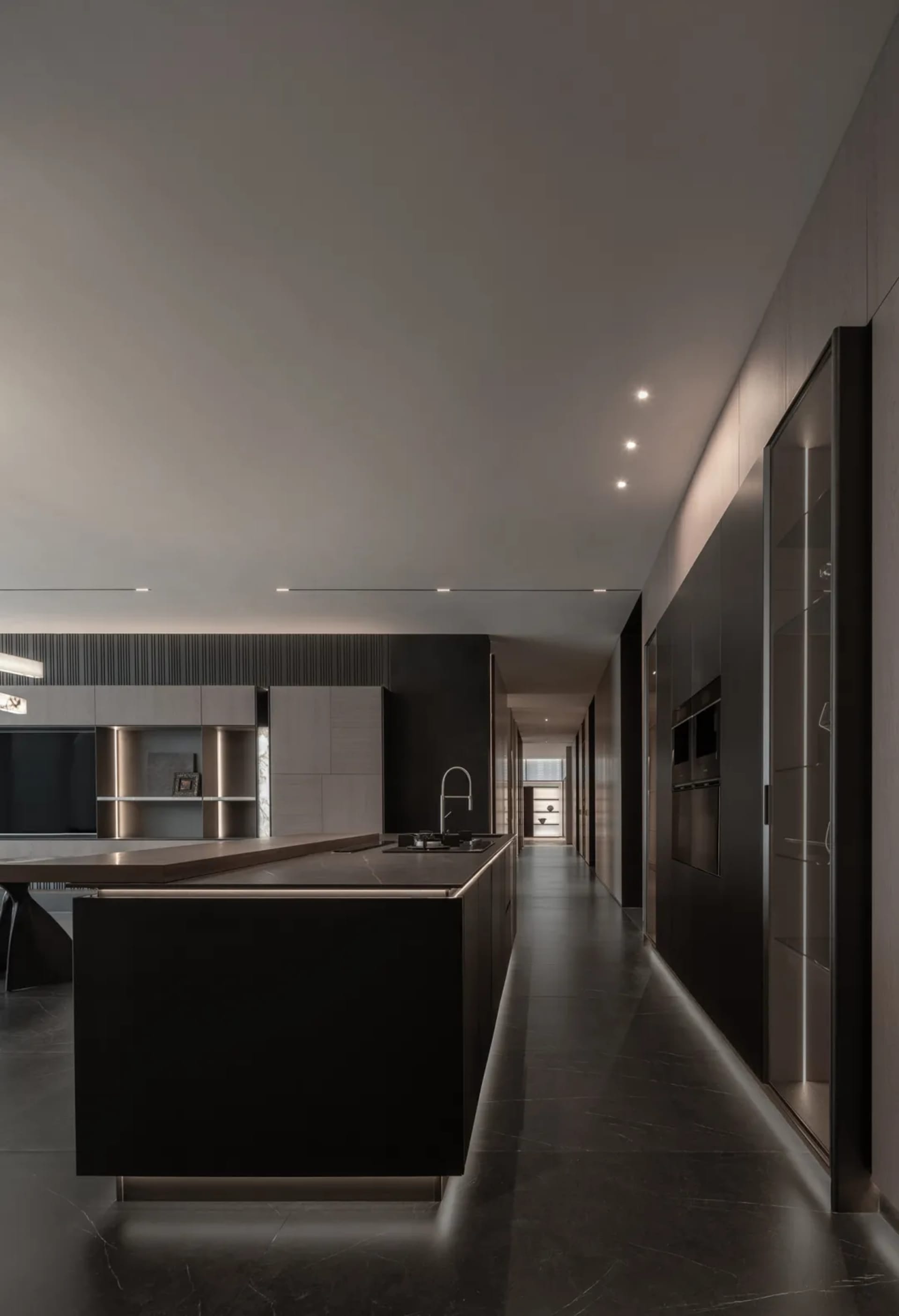 Bright and inviting kitchen and dining area with a black countertop, dining table, and natural light