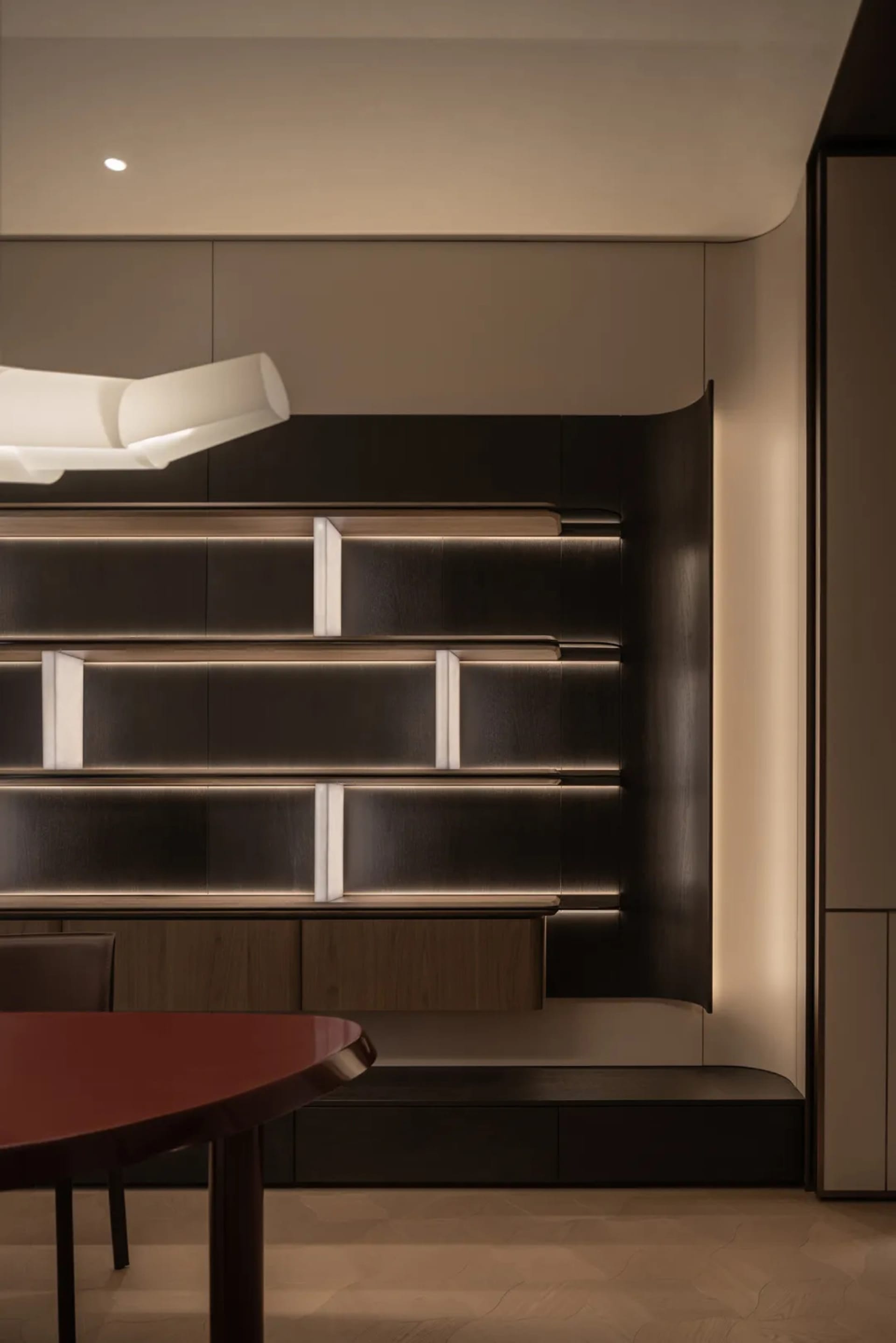Cozy study area with a wooden table and bookshelf, surrounded by soft and diffused lighting, creating a warm and inviting atmosphere