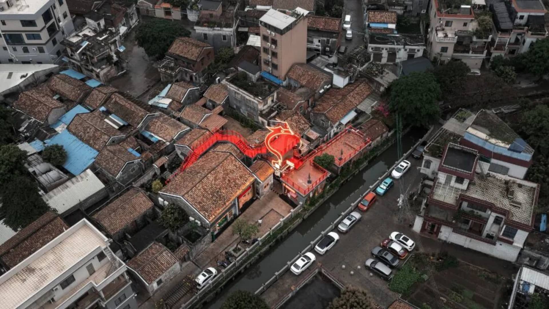 A city street lined with brick buildings and cars, capturing the essence of urban life with a blend of architecture and transportation
