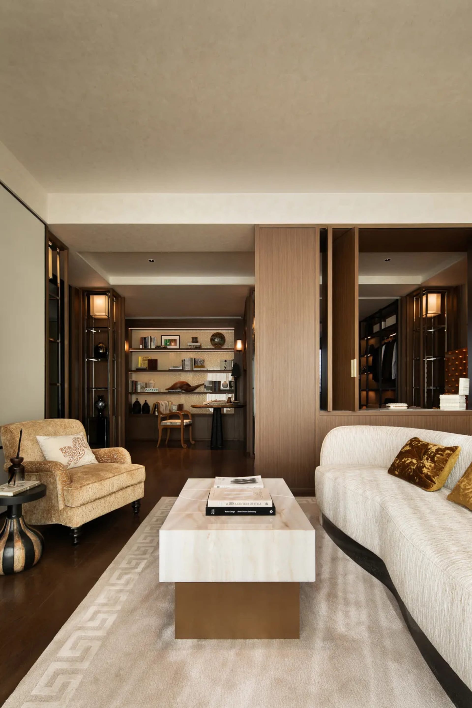 Warm and inviting living and dining space with wooden furniture, decorative items, and natural lighting