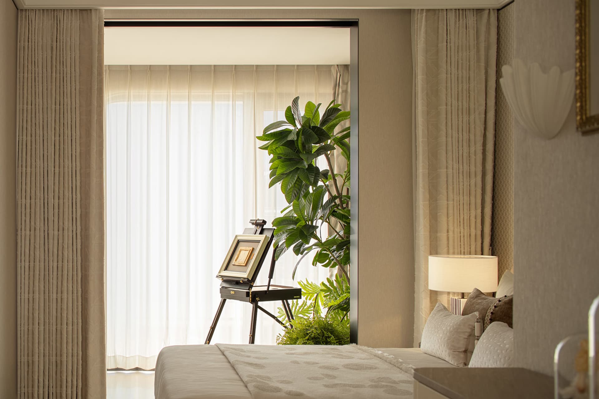 A well-lit bedroom with a bed, a potted plant, and a painting on a stand, surrounded by white curtains and wood accents