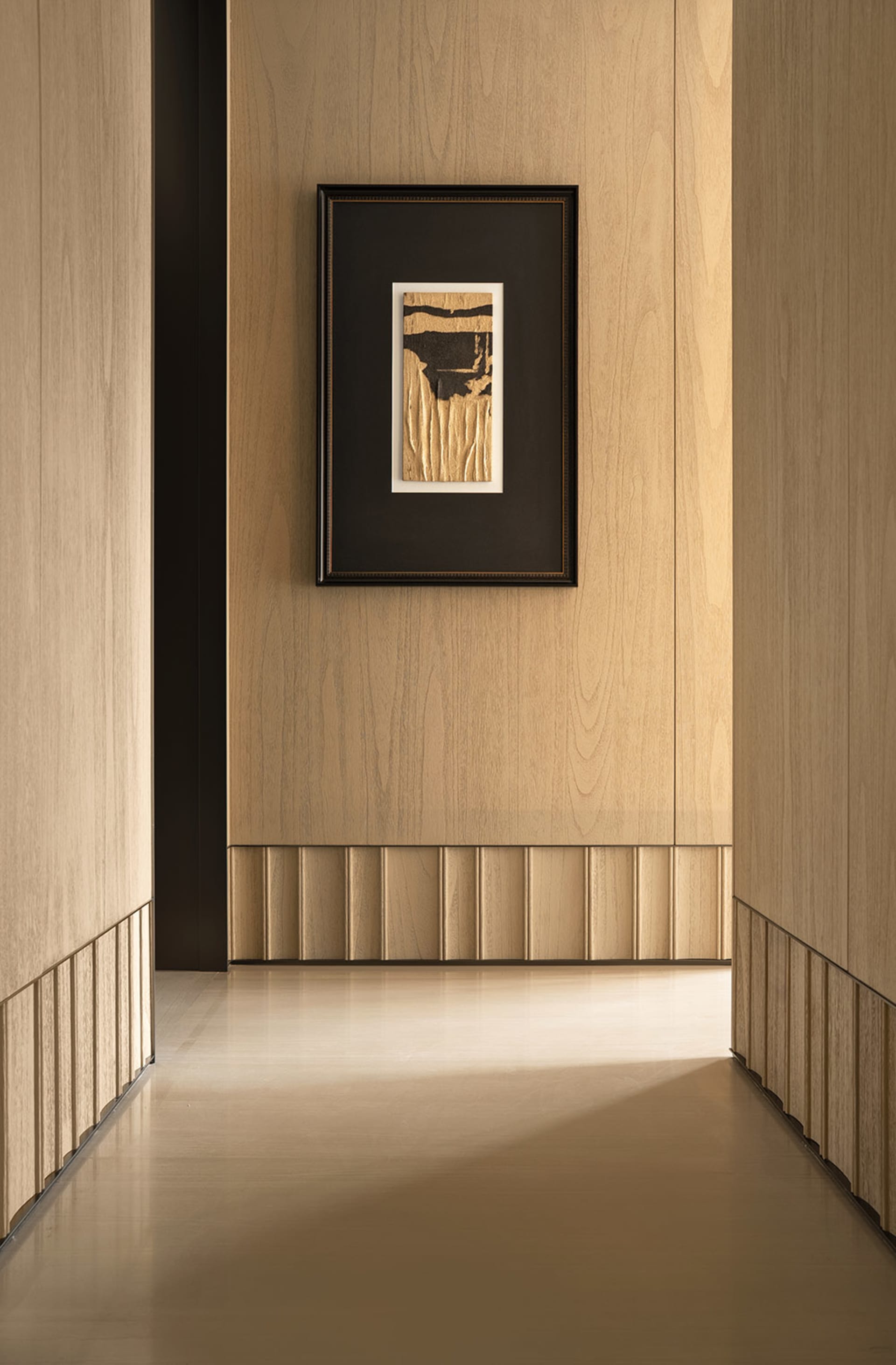 A warm and natural room interior with a wooden floor and frame, featuring a picture on the wall